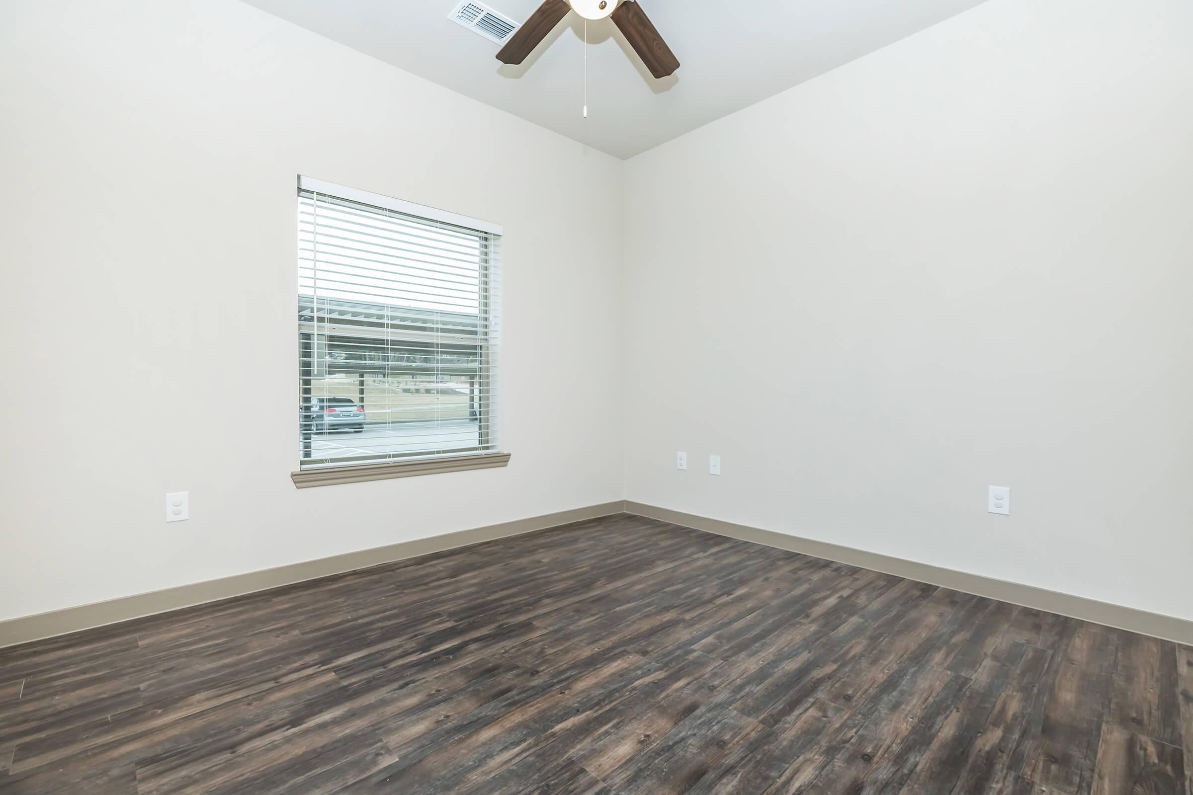 a bedroom with a large window