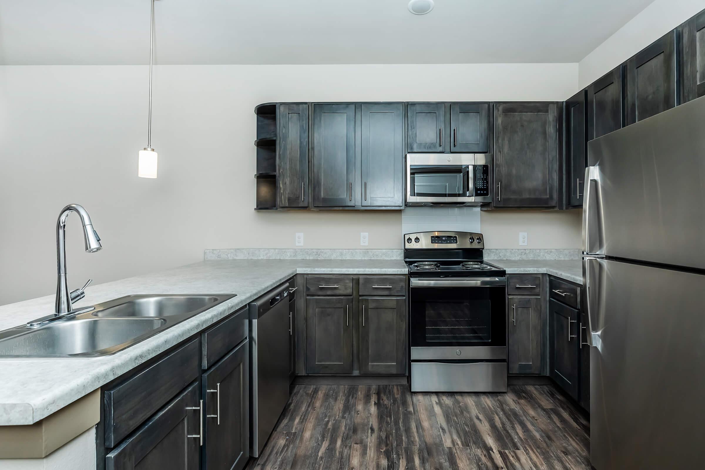 a large kitchen with stainless steel appliances