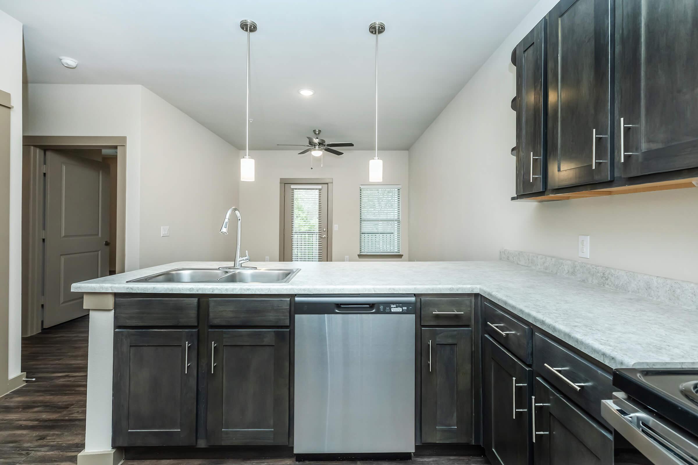 a large kitchen with stainless steel appliances