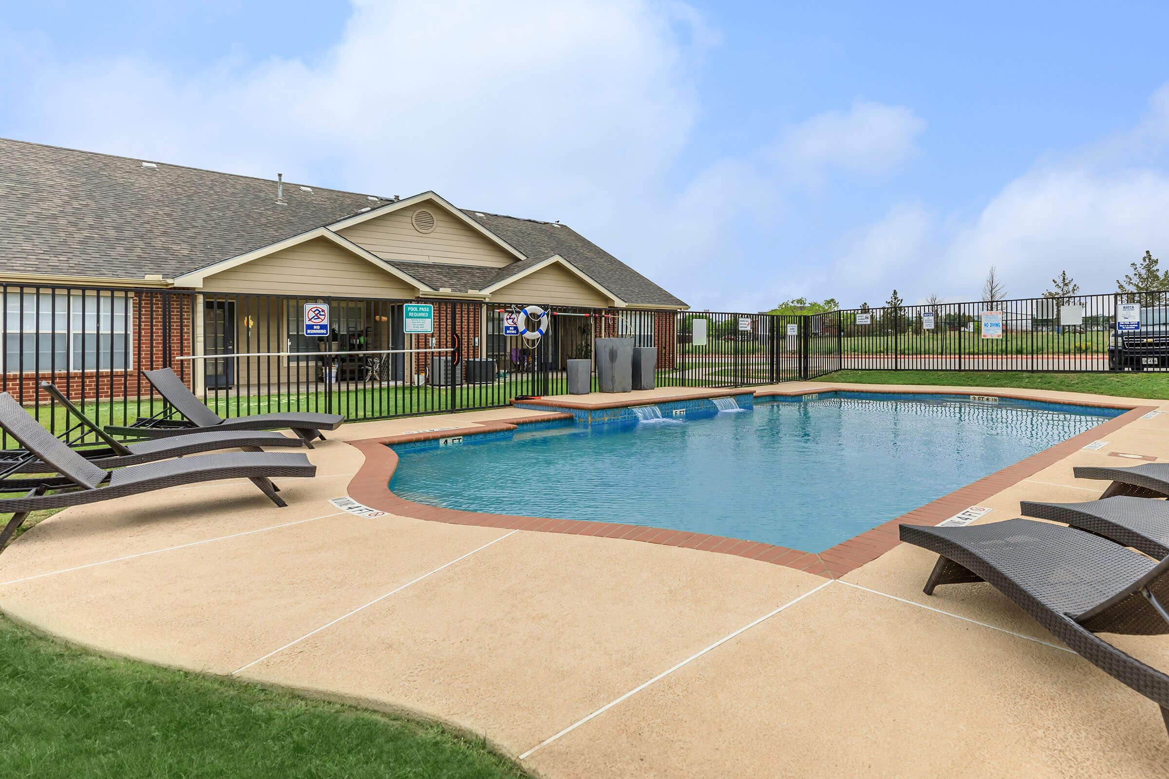 a pool of water in front of a house