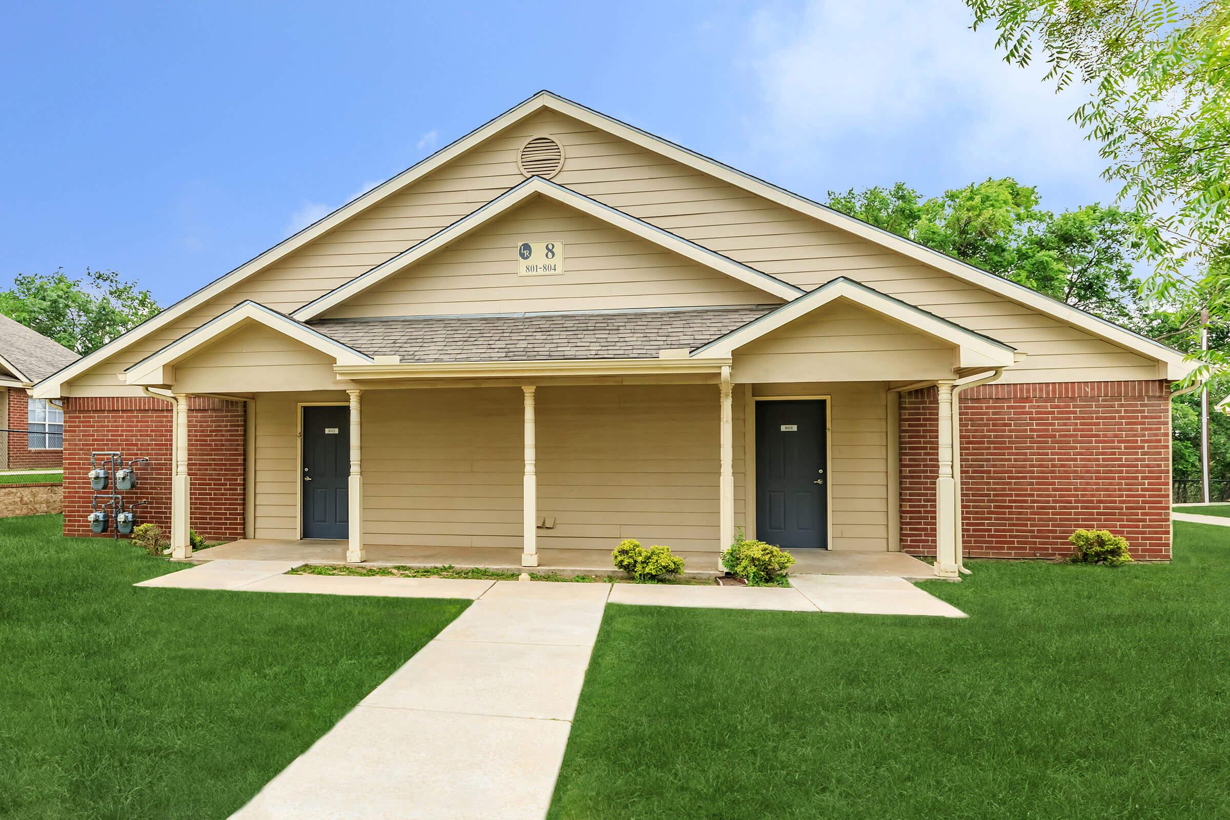 a large lawn in front of a house