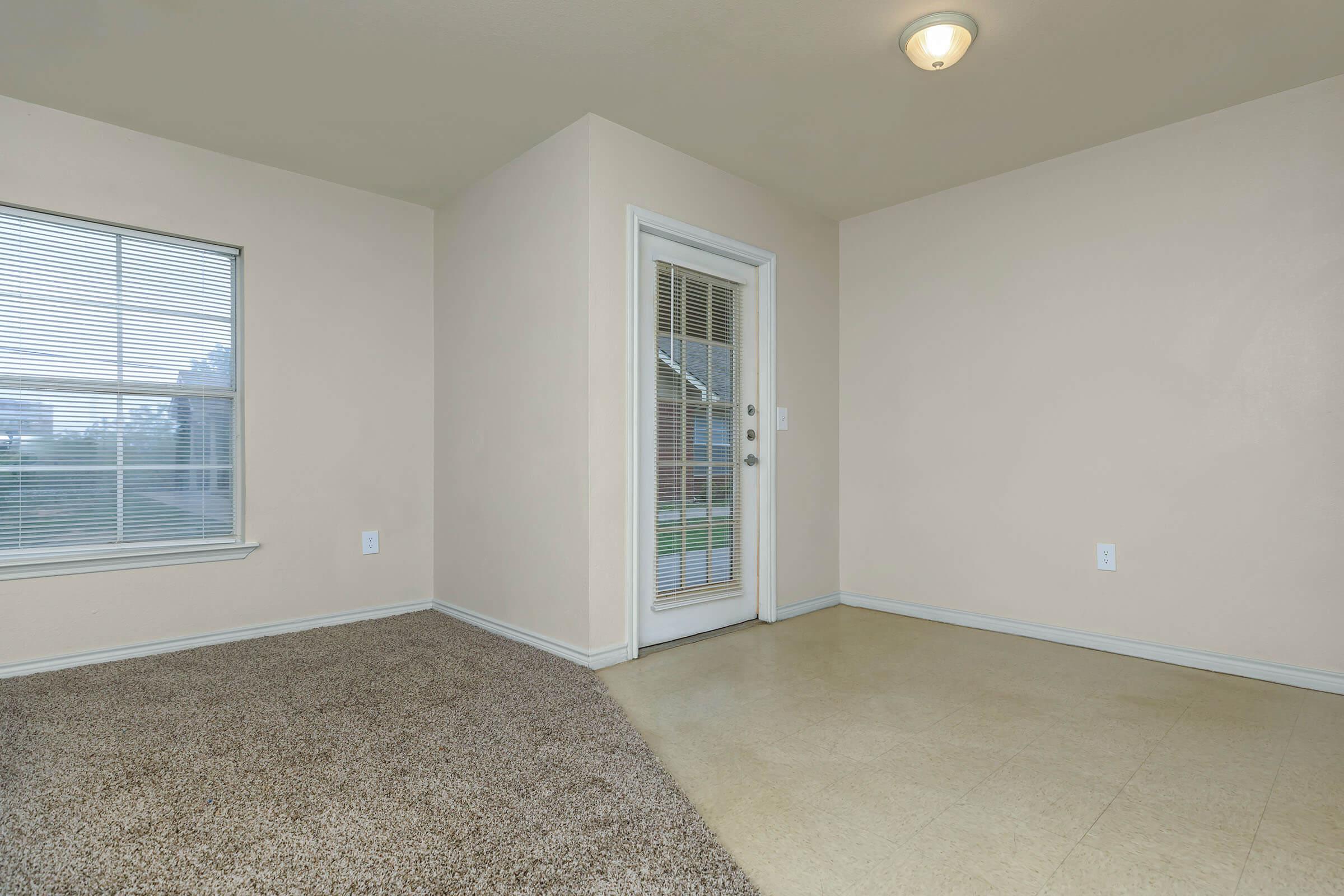 a bedroom with a large window