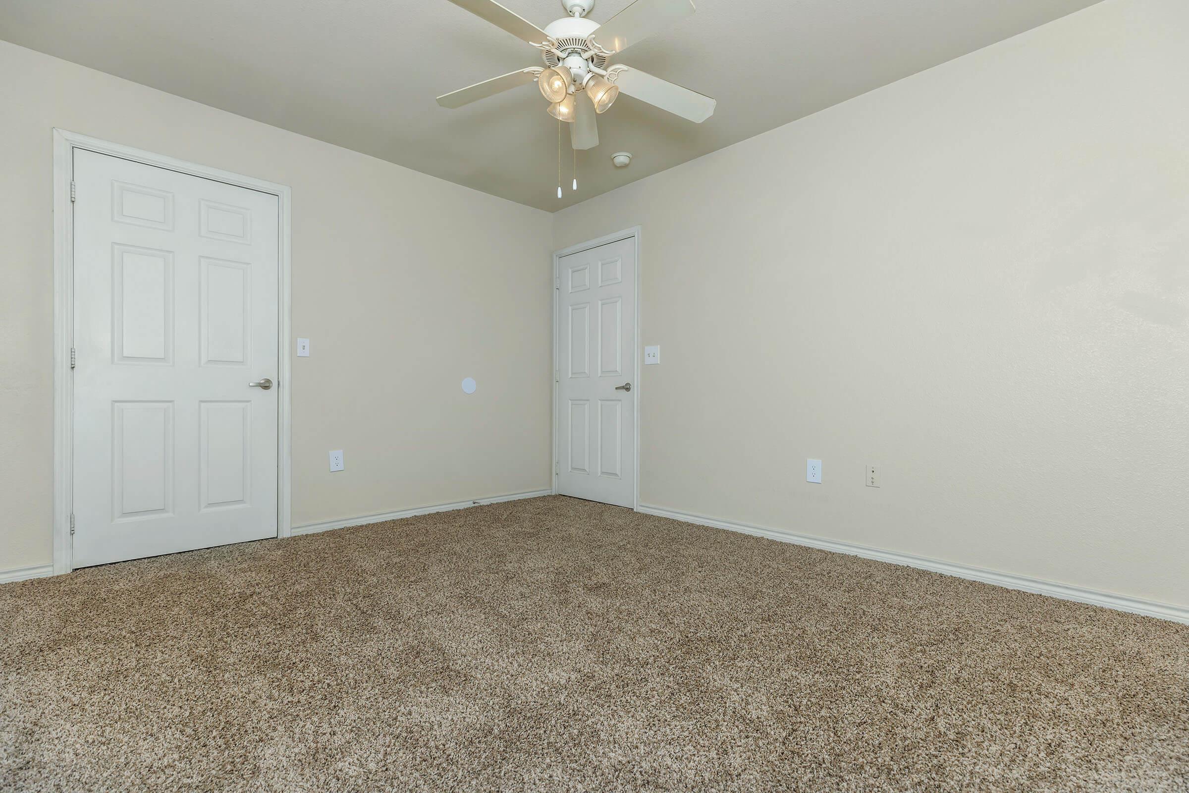 a bedroom with a large mirror