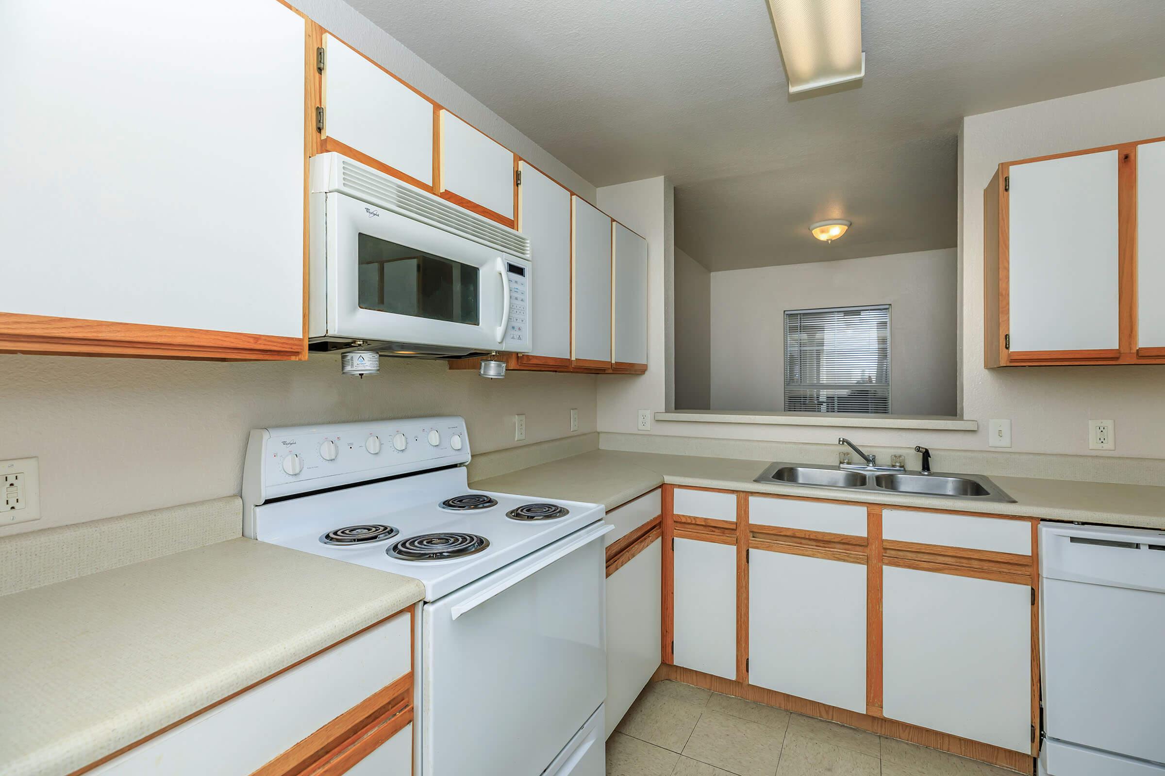 a kitchen with a sink and a window