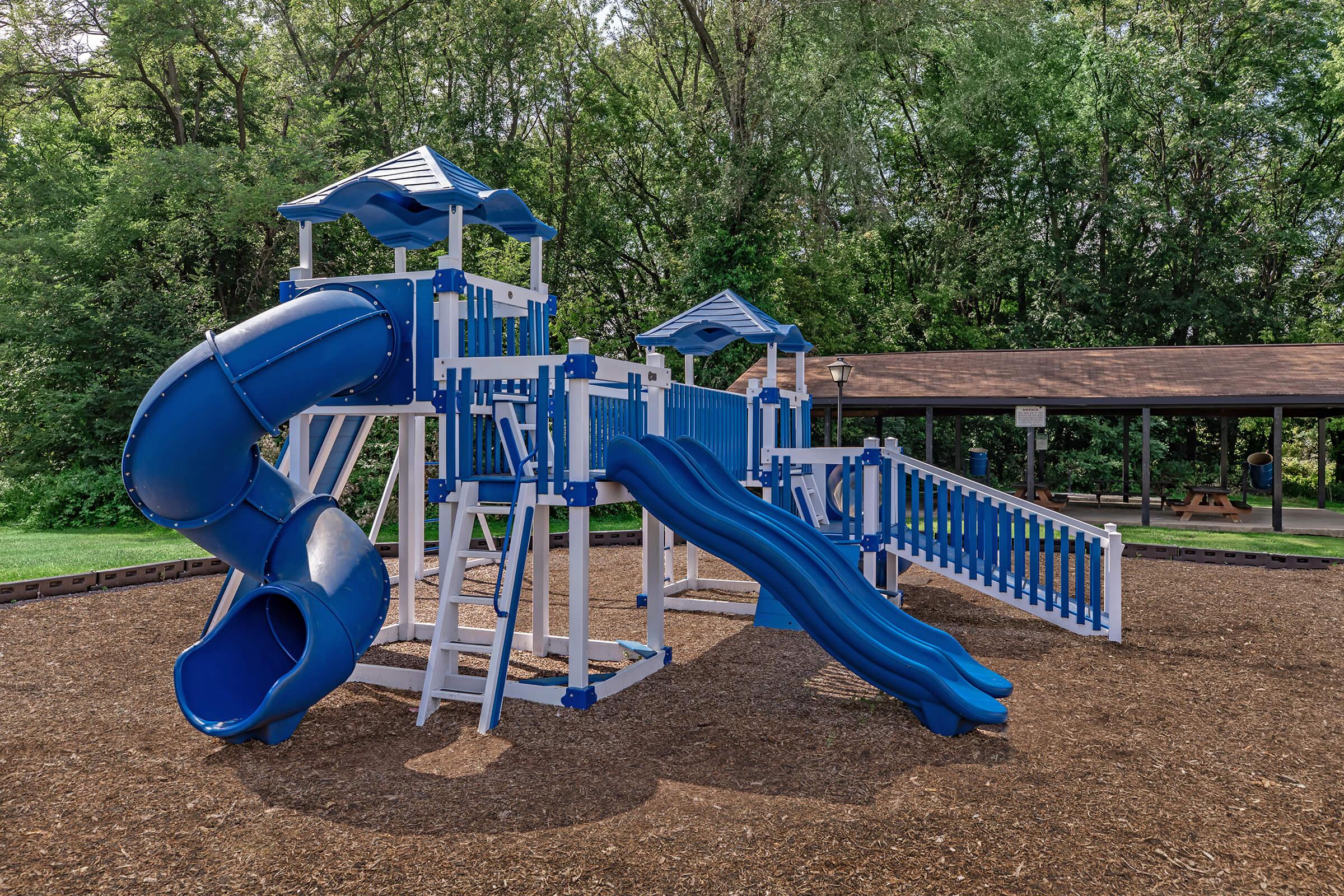 a playground with a blue chair