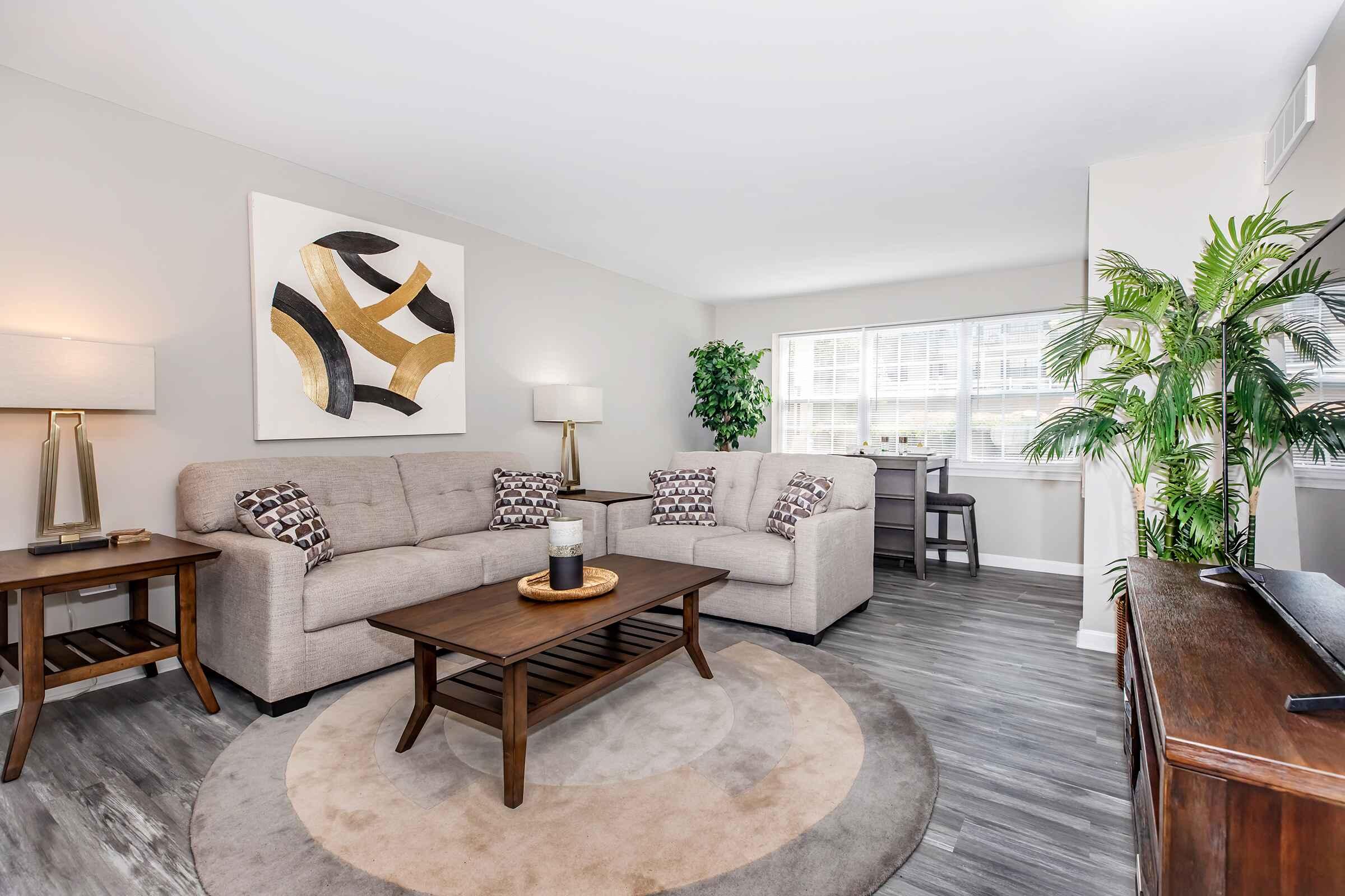 a living room filled with furniture and a fireplace