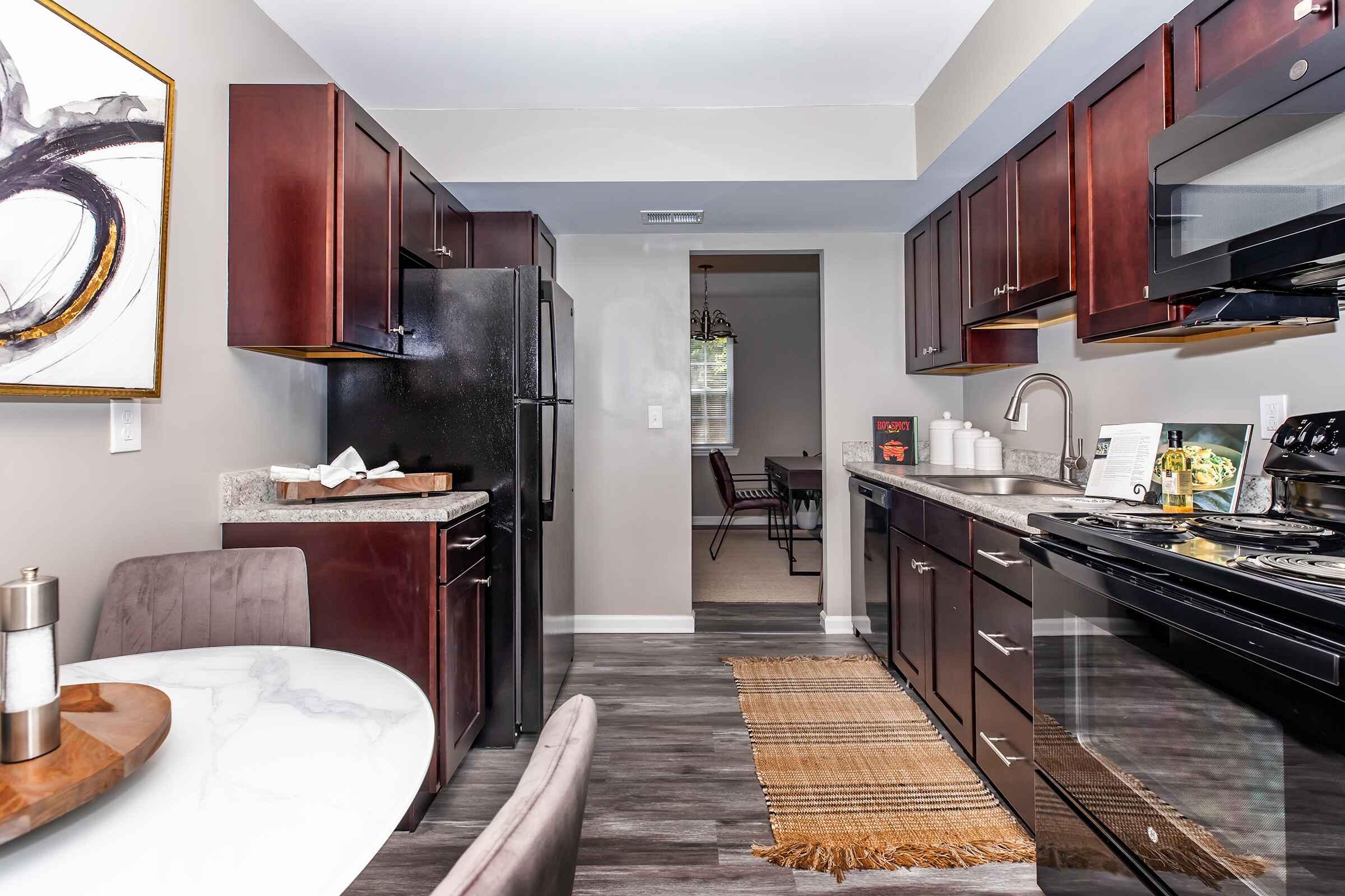 a kitchen with an island in the middle of a room