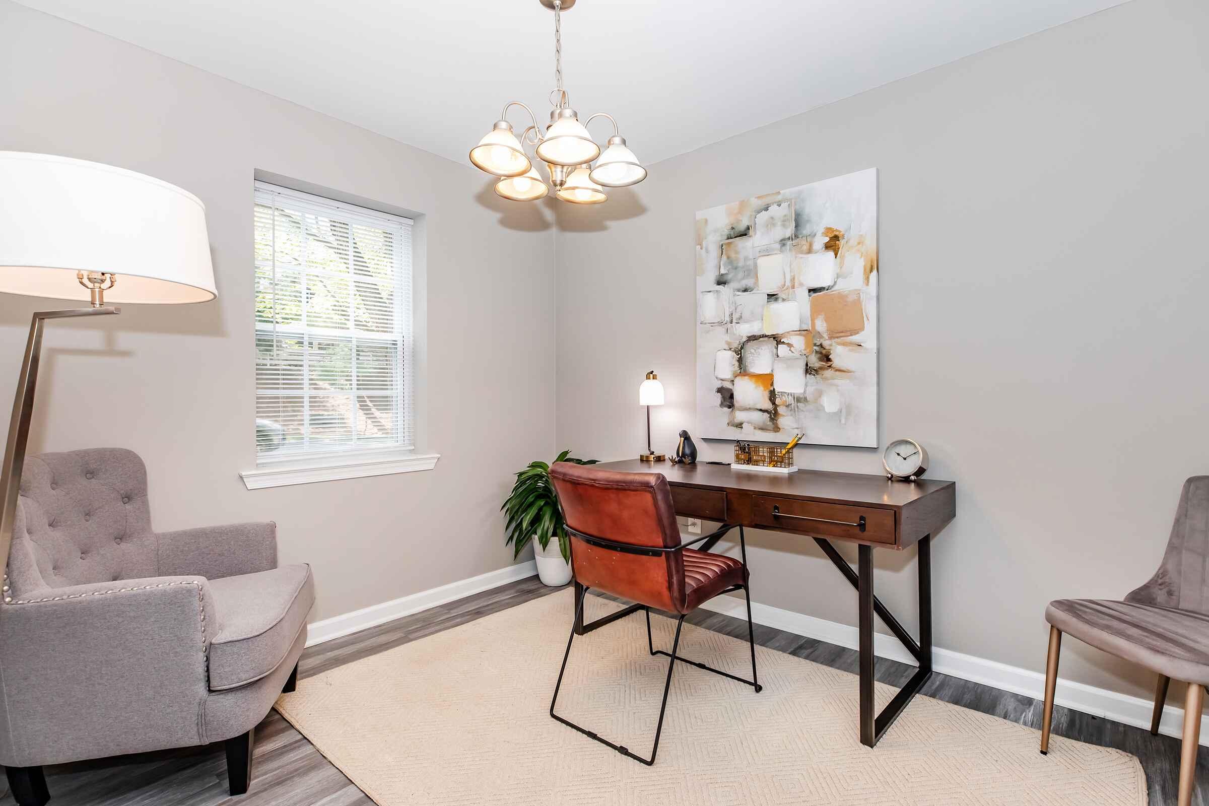 a living room filled with furniture and a flat screen tv