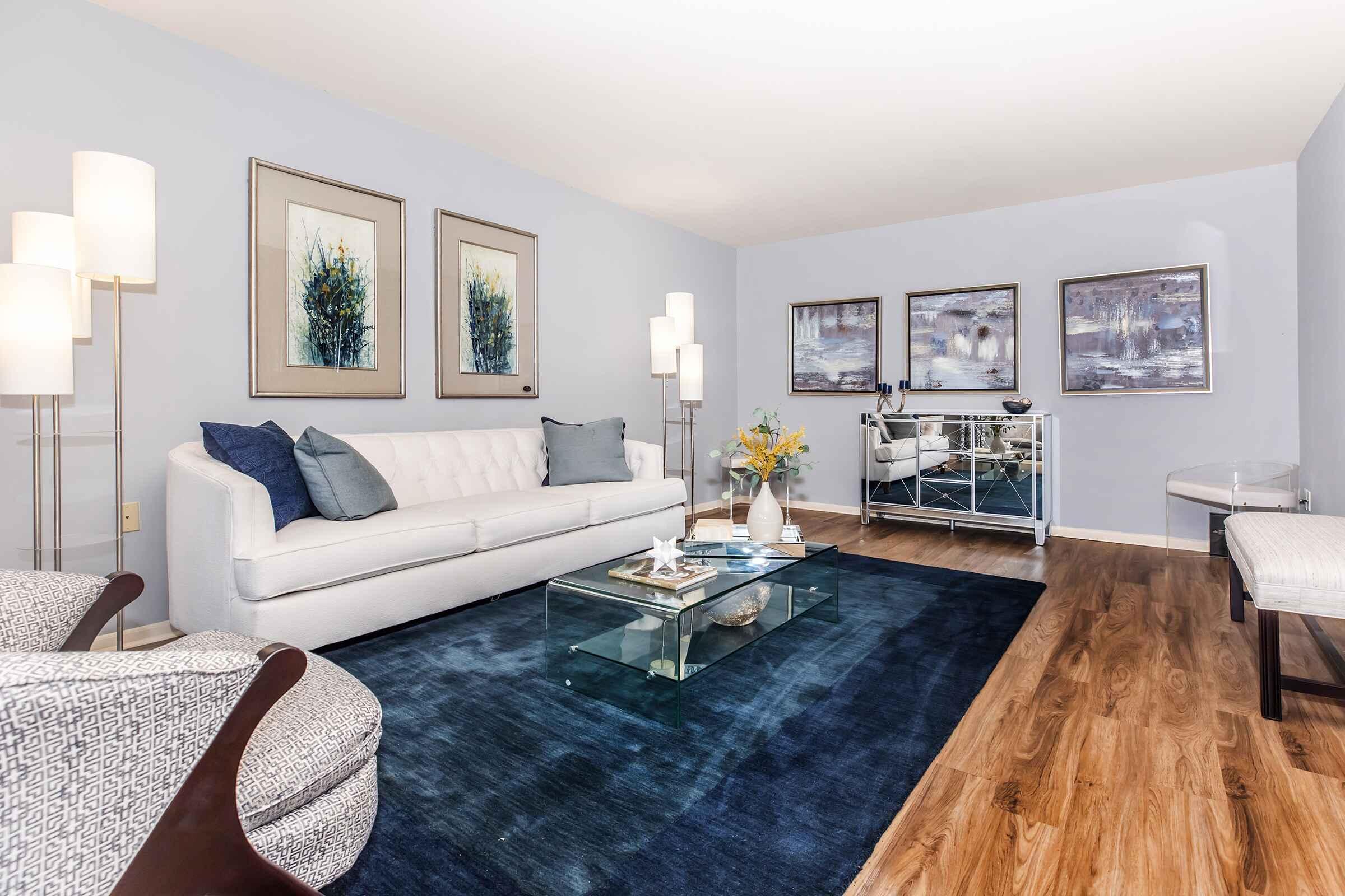 a living room filled with furniture and a fireplace