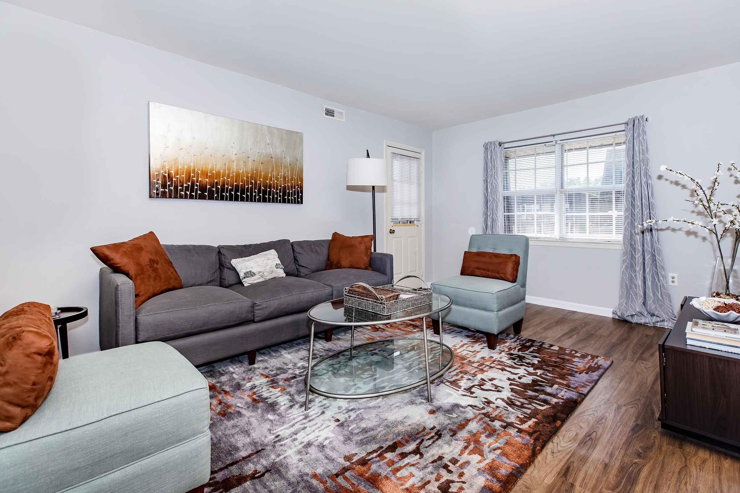 a living room filled with furniture and a fire place