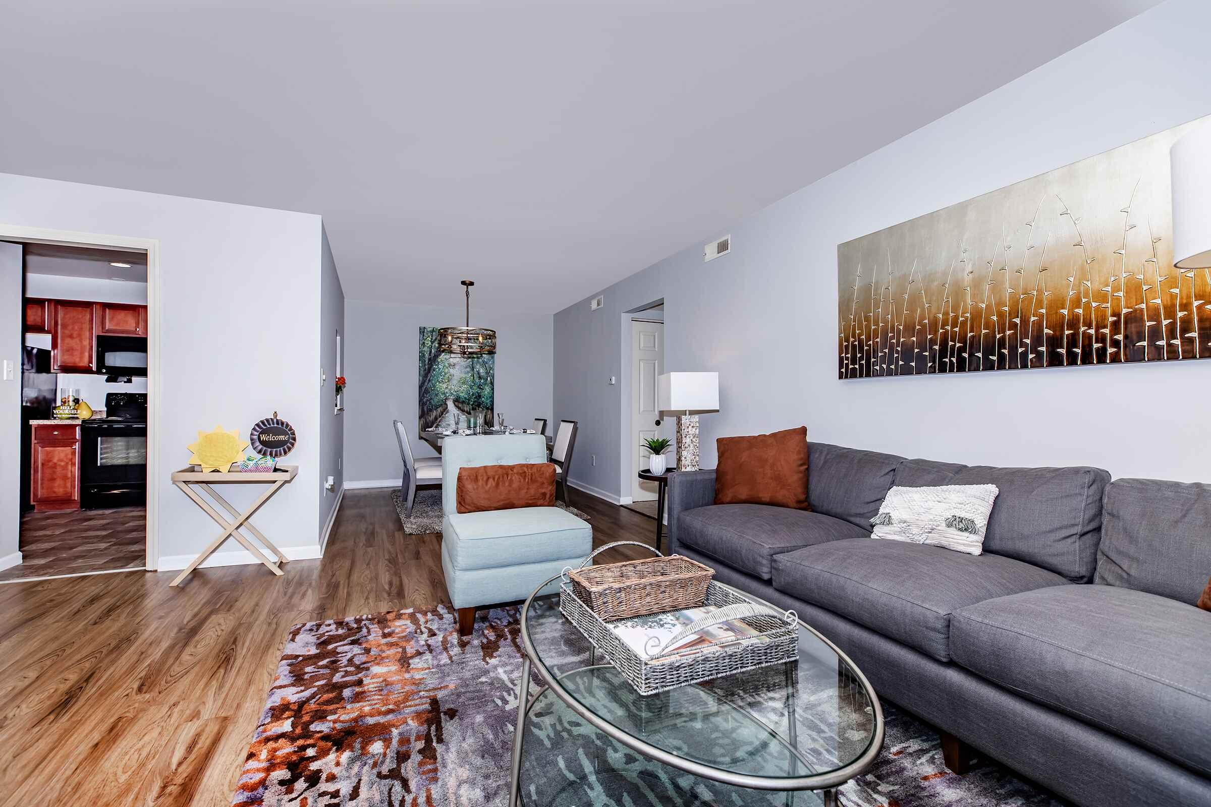 a living room filled with furniture and a flat screen tv