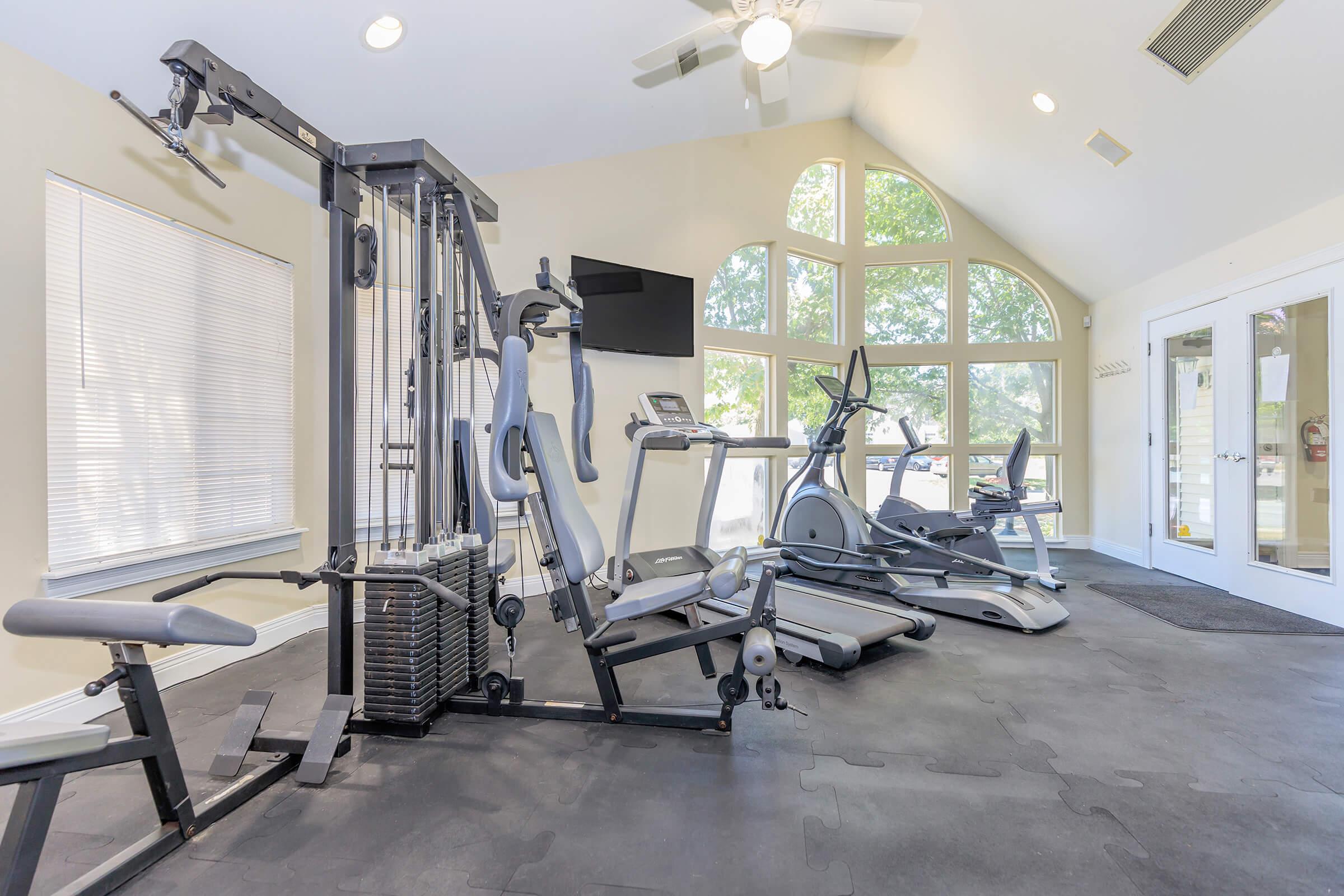 a room filled with furniture and a large window