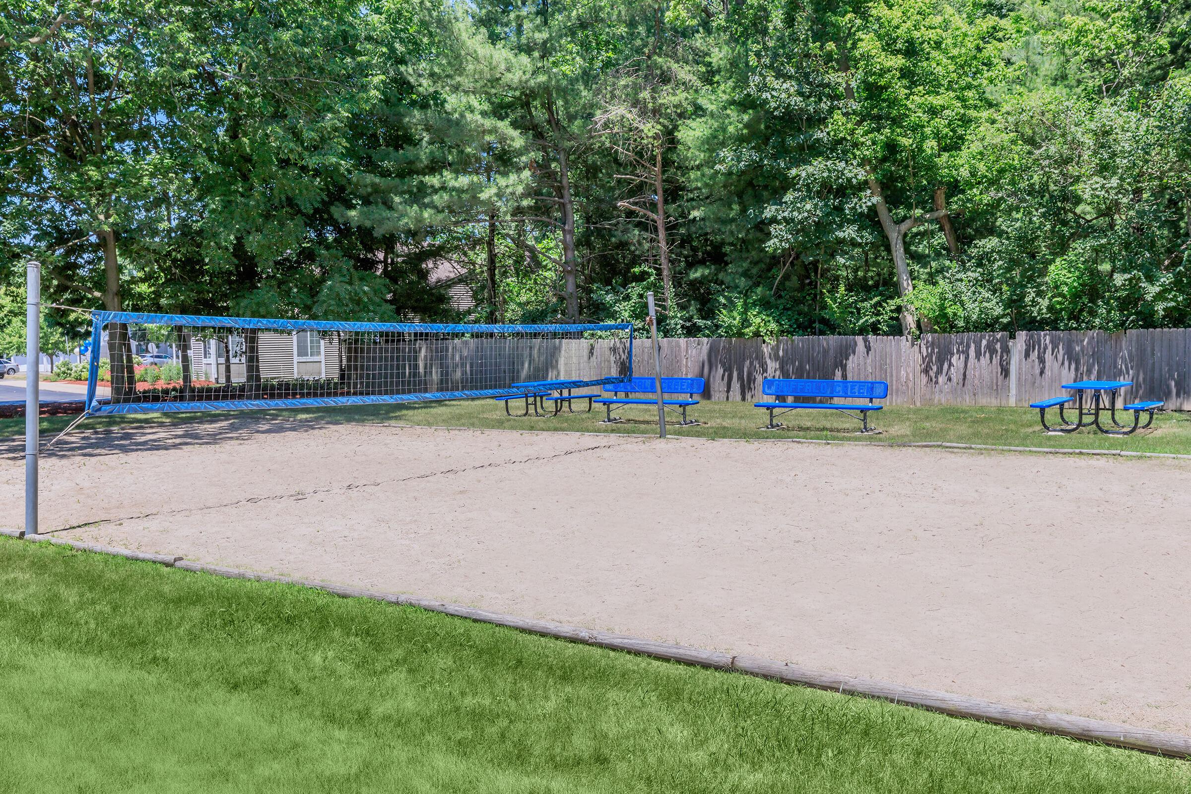 a blue bench in a park