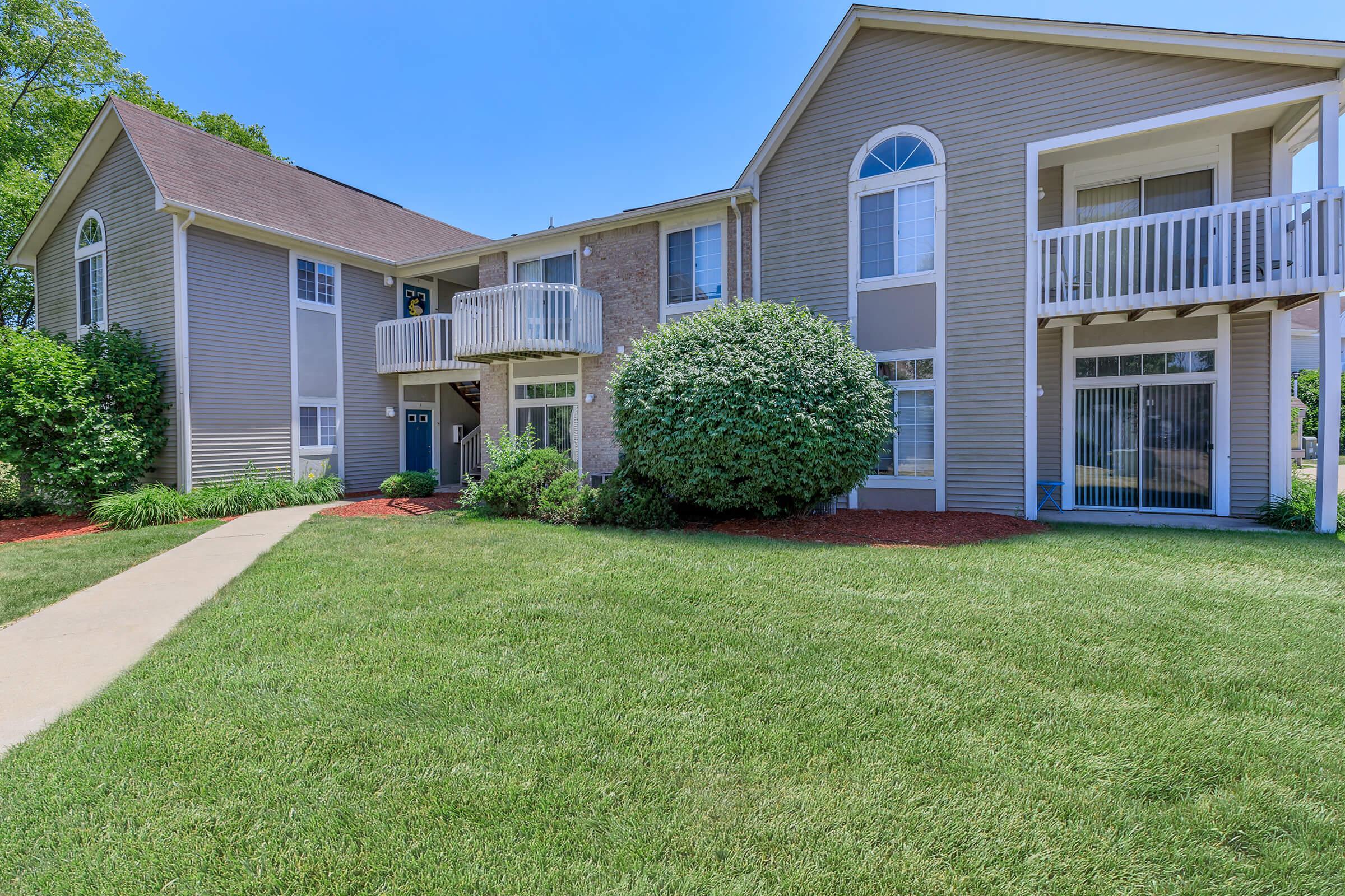 a large lawn in front of a house