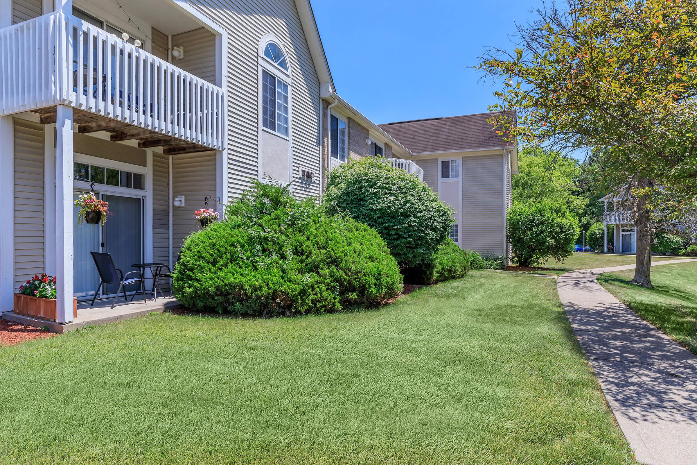 a large lawn in front of a house