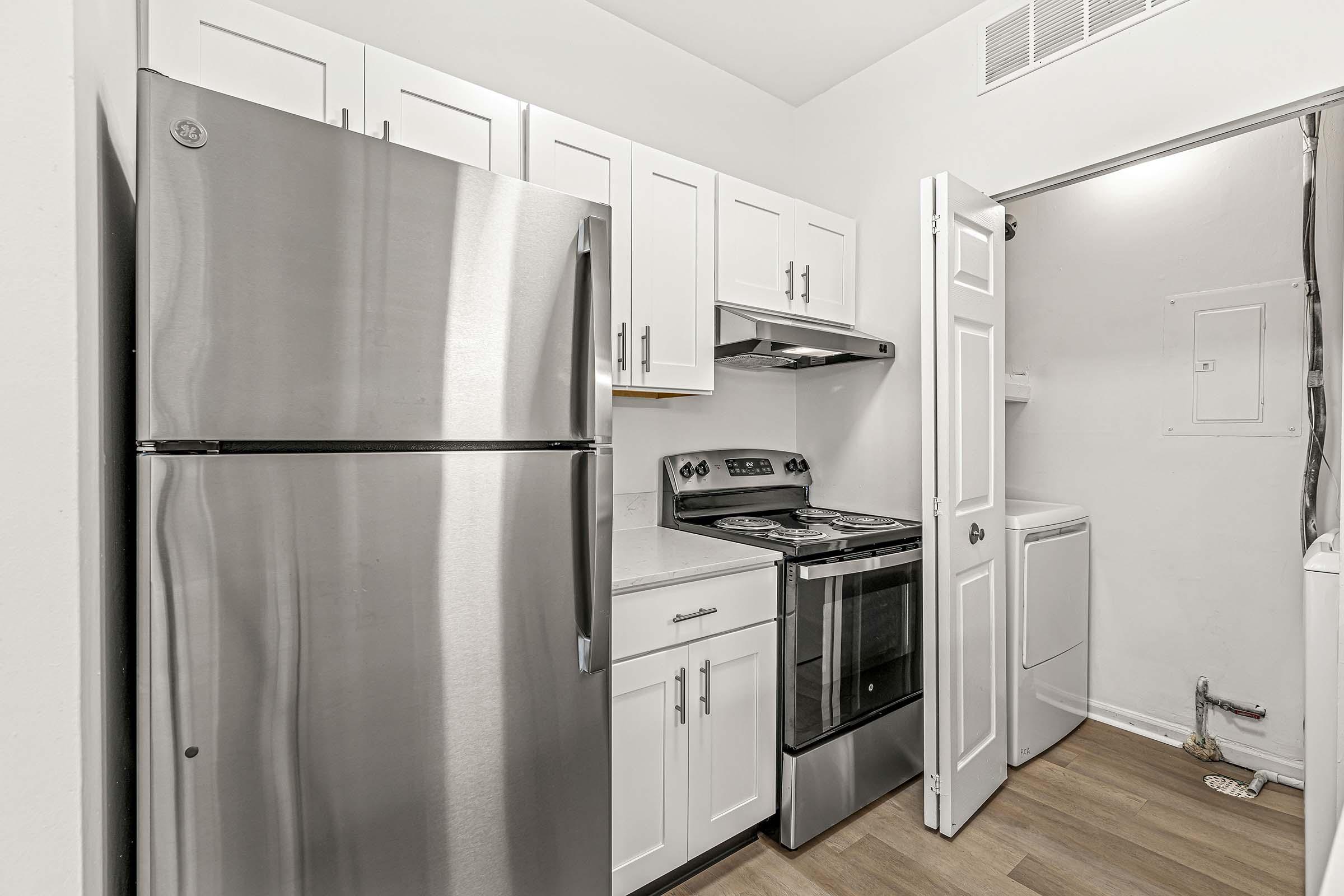 a stainless steel refrigerator in a kitchen