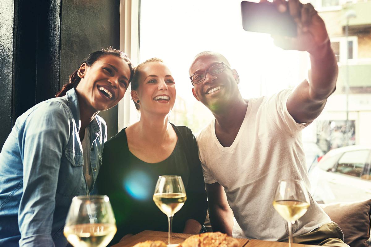 a person holding a glass of wine