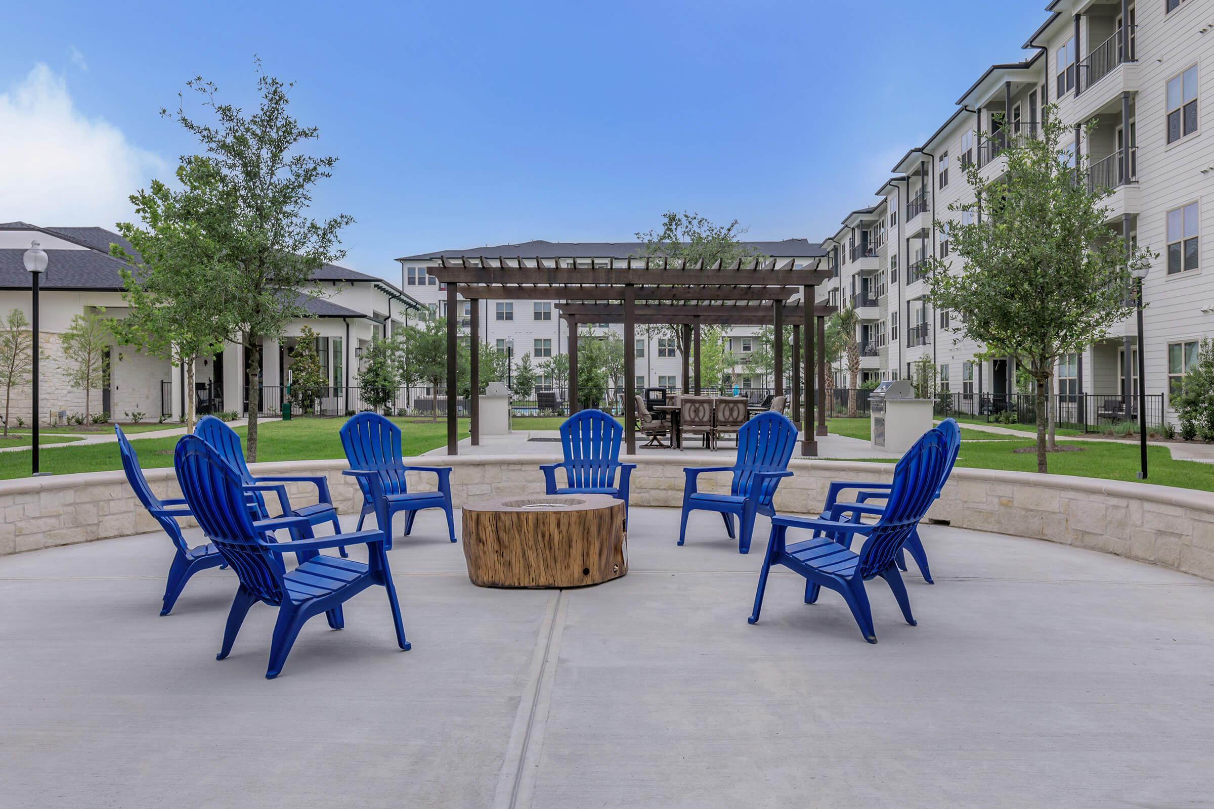 a person sitting on a bench in a park