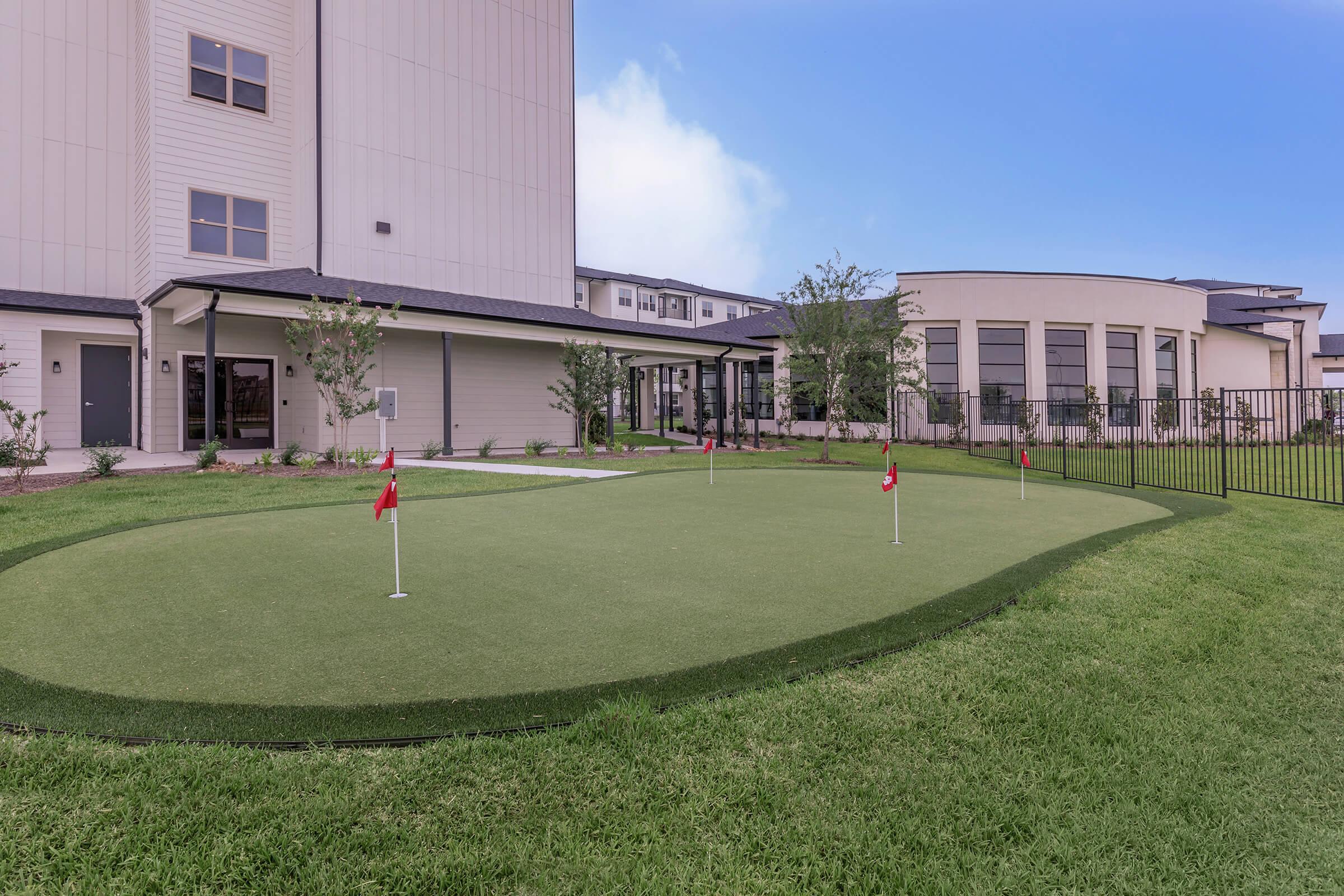 a large lawn in front of a building