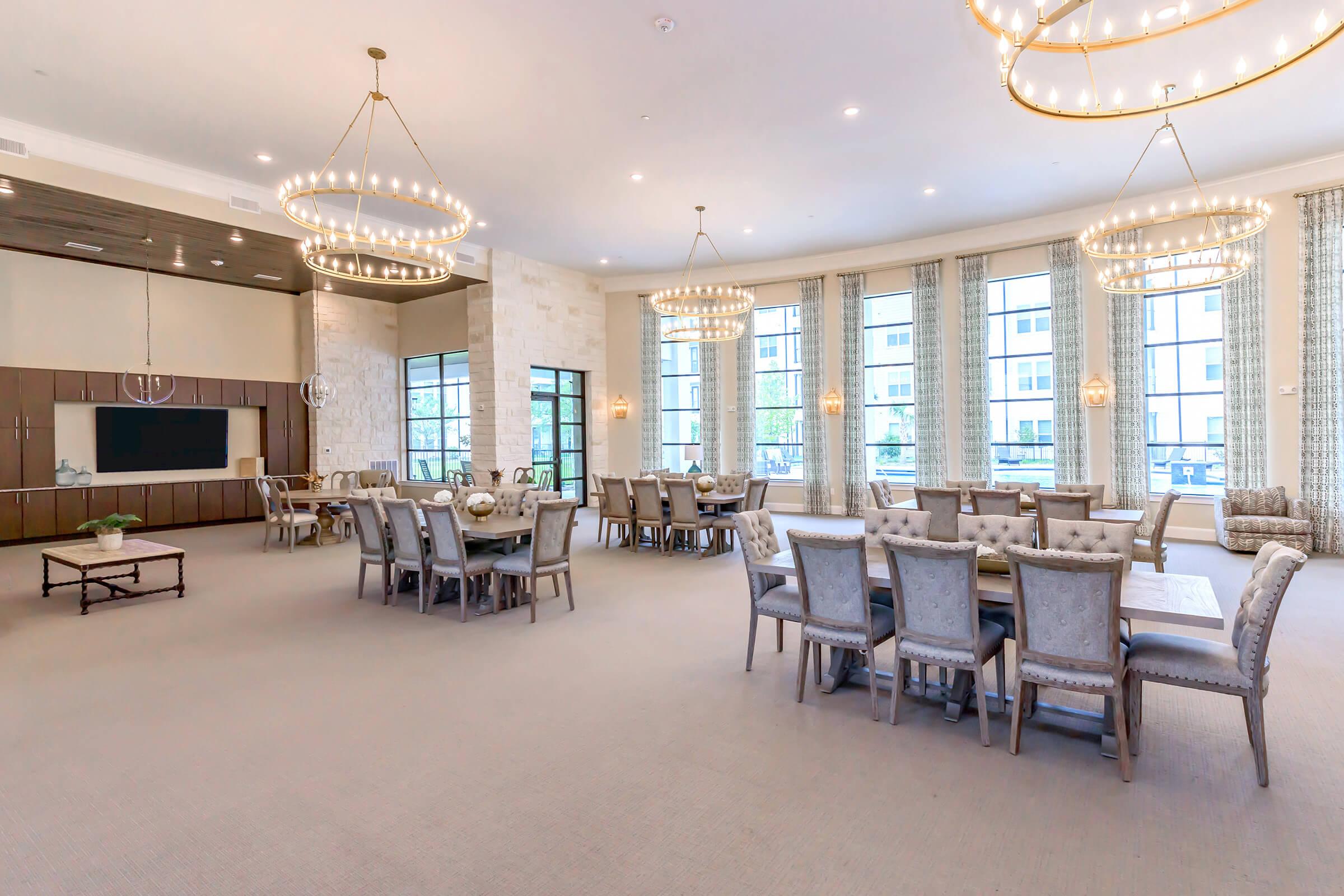 a room filled with furniture and a large window