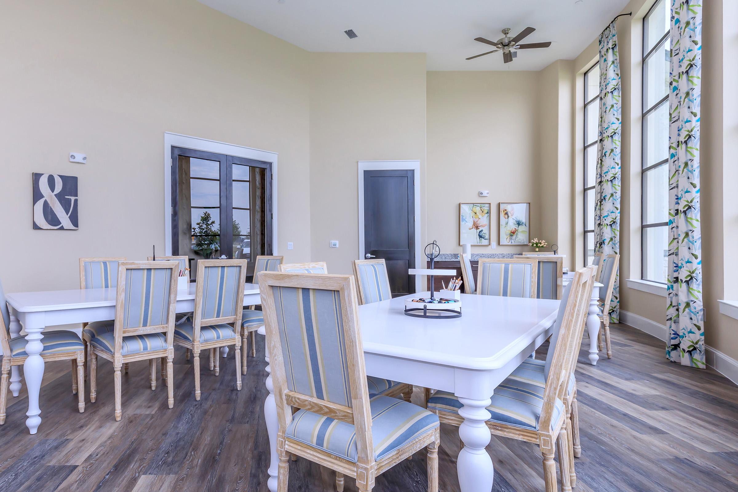 a room filled with furniture and a large window