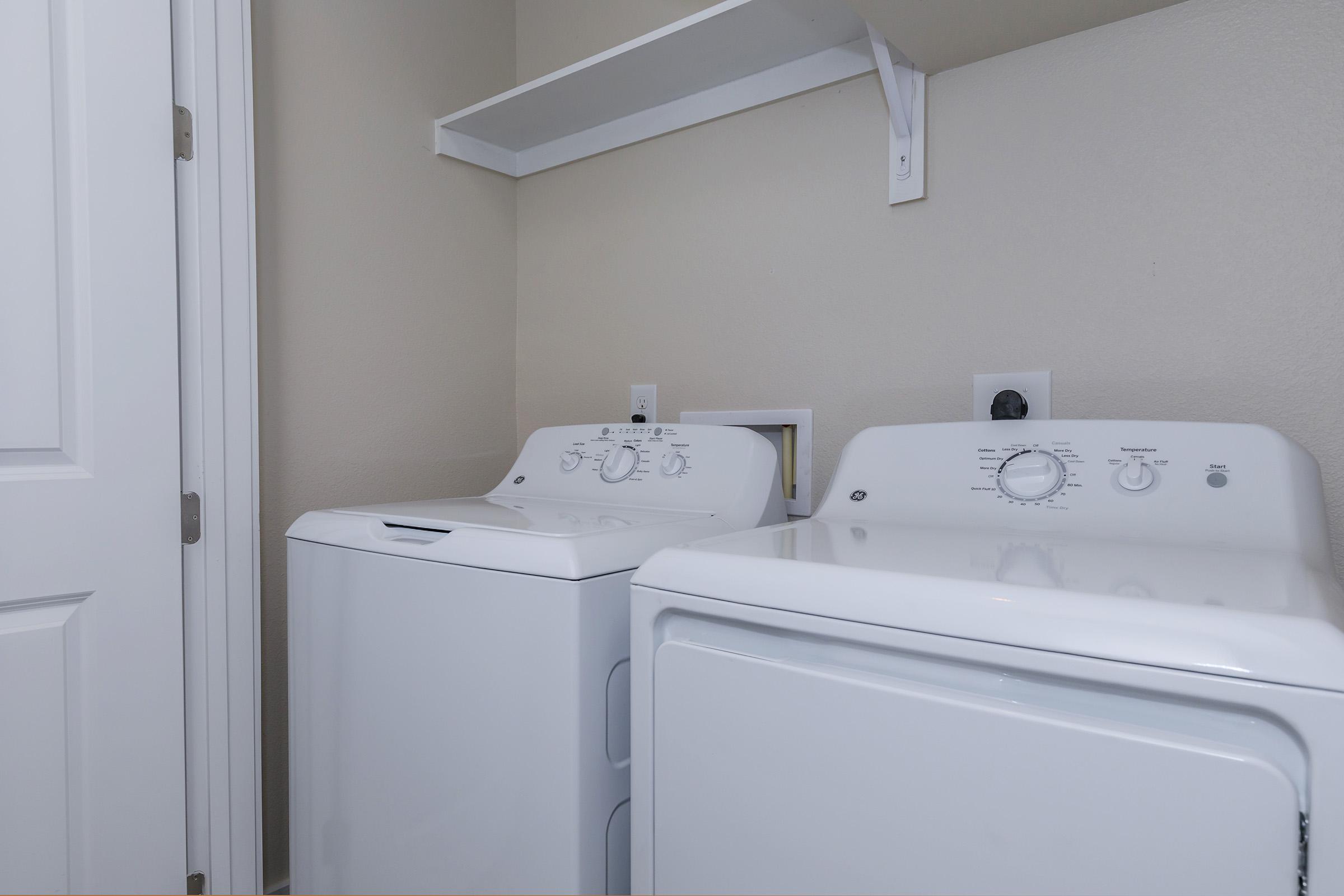 a kitchen with a sink and a refrigerator