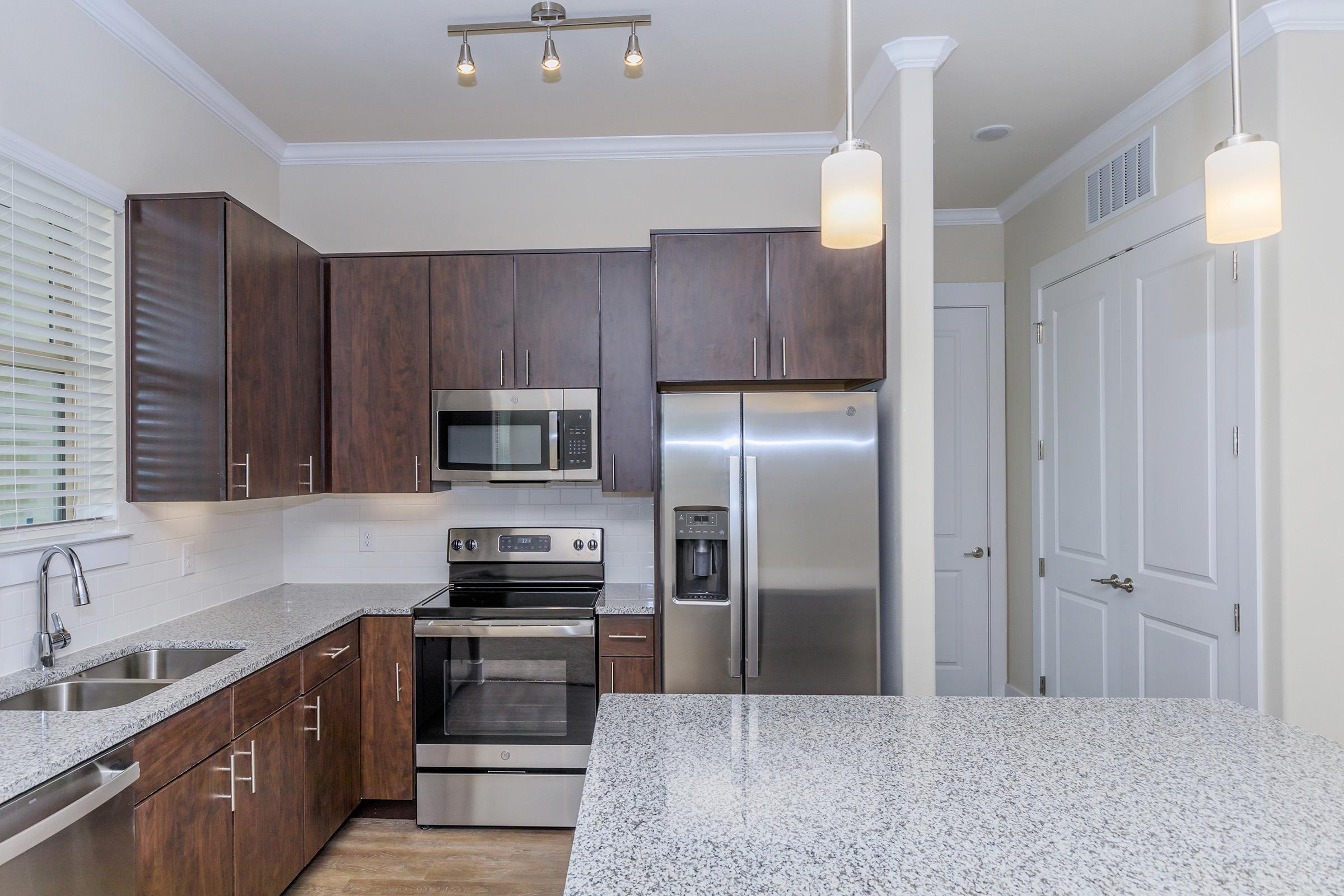 a modern kitchen with stainless steel appliances