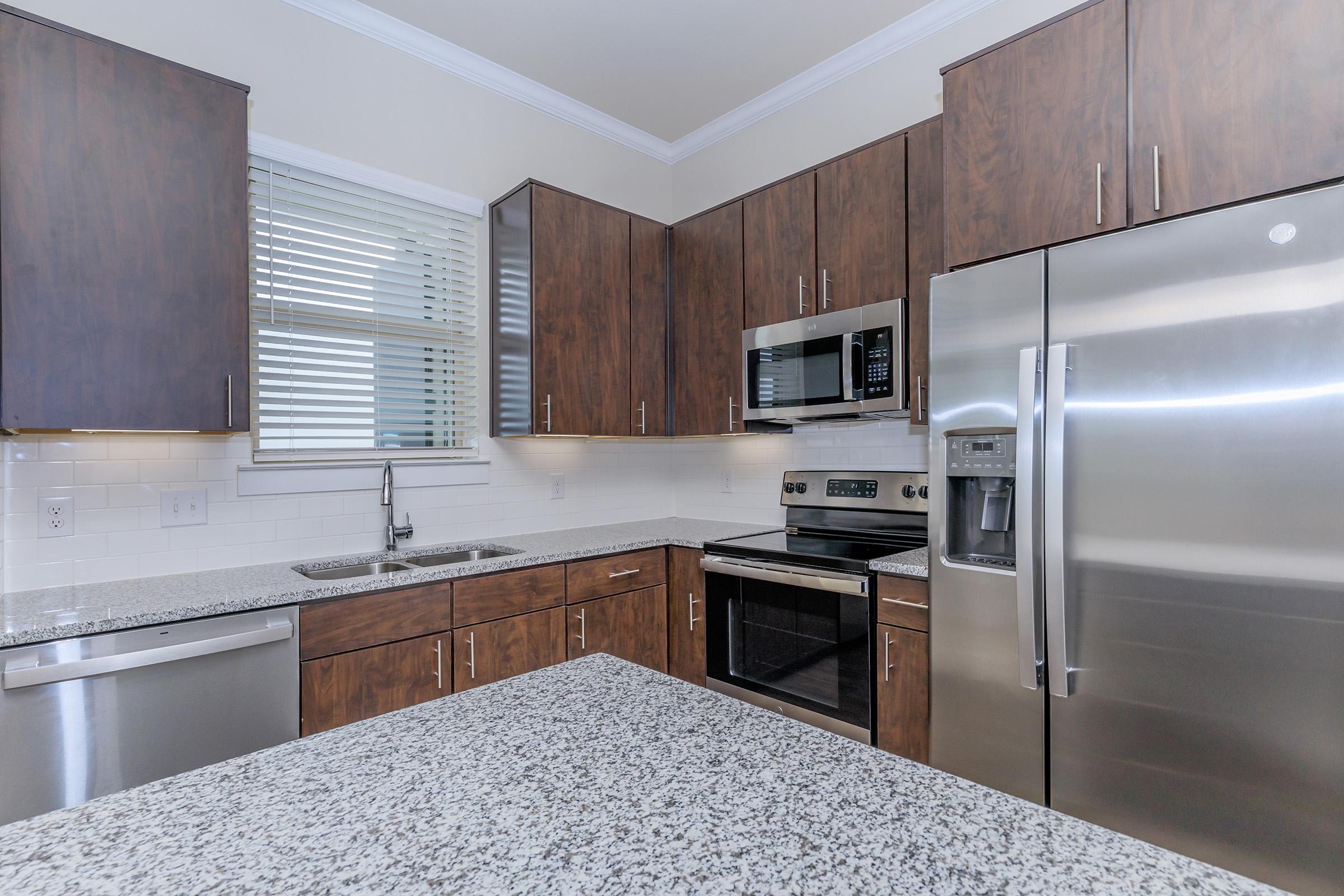 a modern kitchen with stainless steel appliances