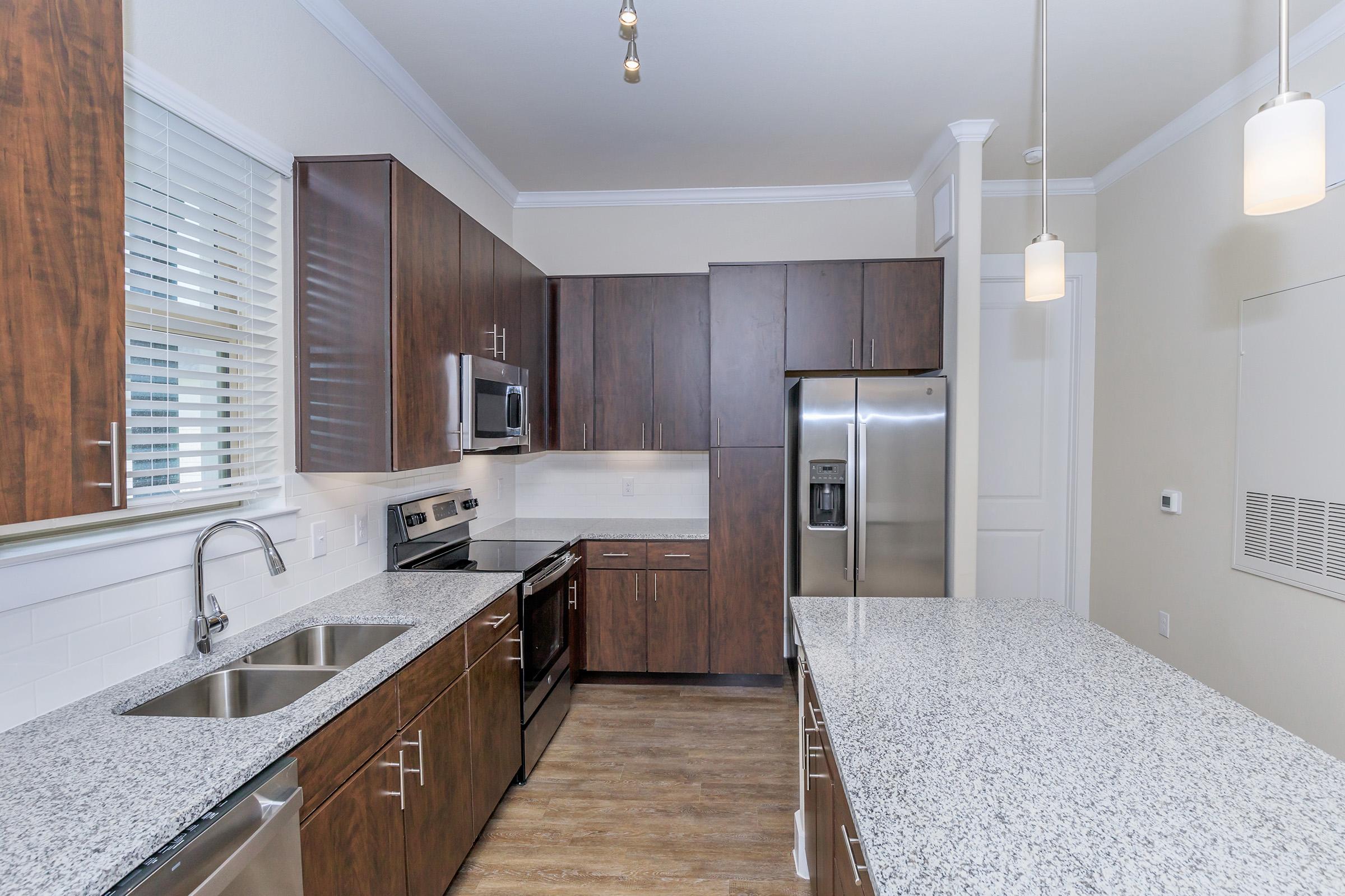 a large kitchen with stainless steel appliances