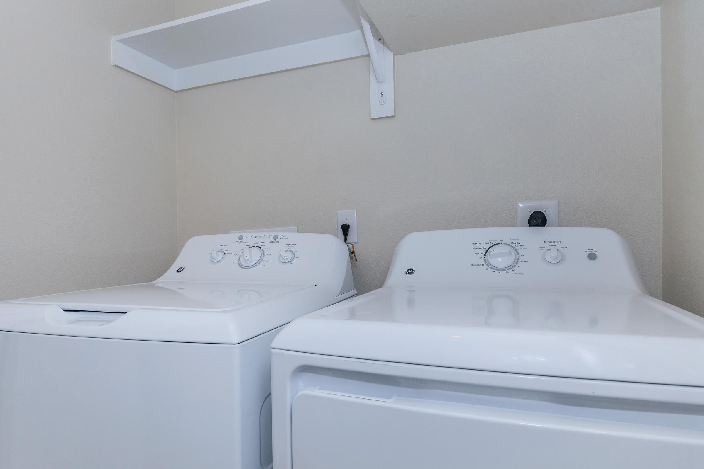 a stove top oven sitting next to a sink