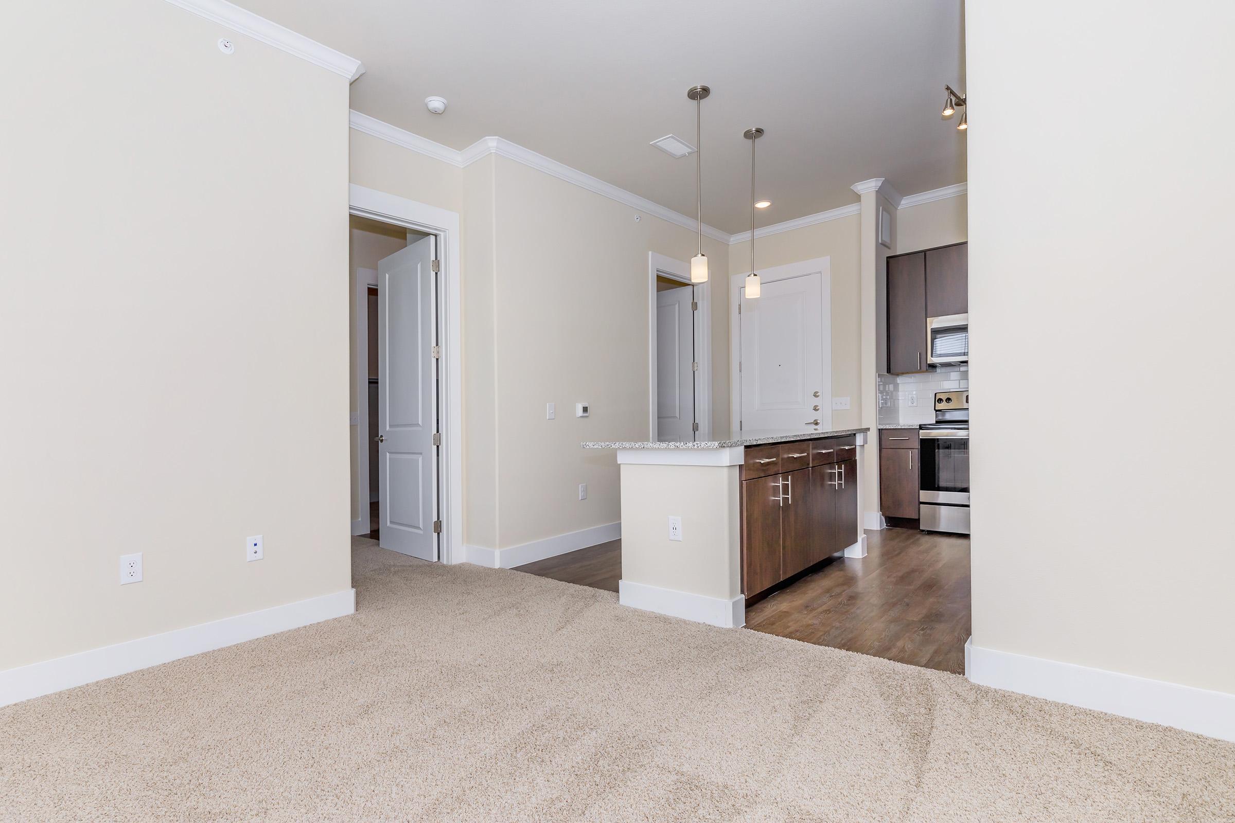 a kitchen with a sink and a refrigerator