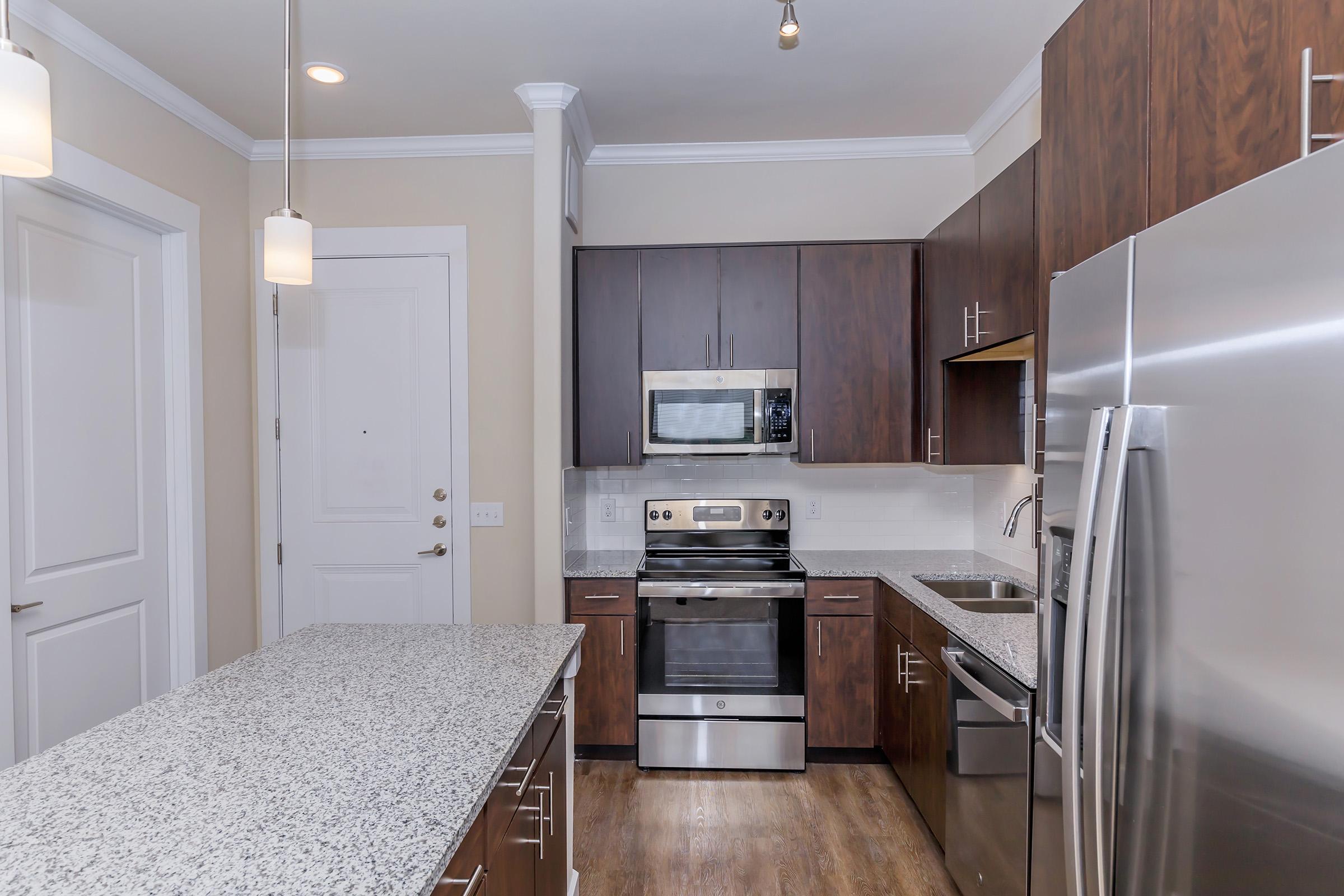 a modern kitchen with stainless steel appliances