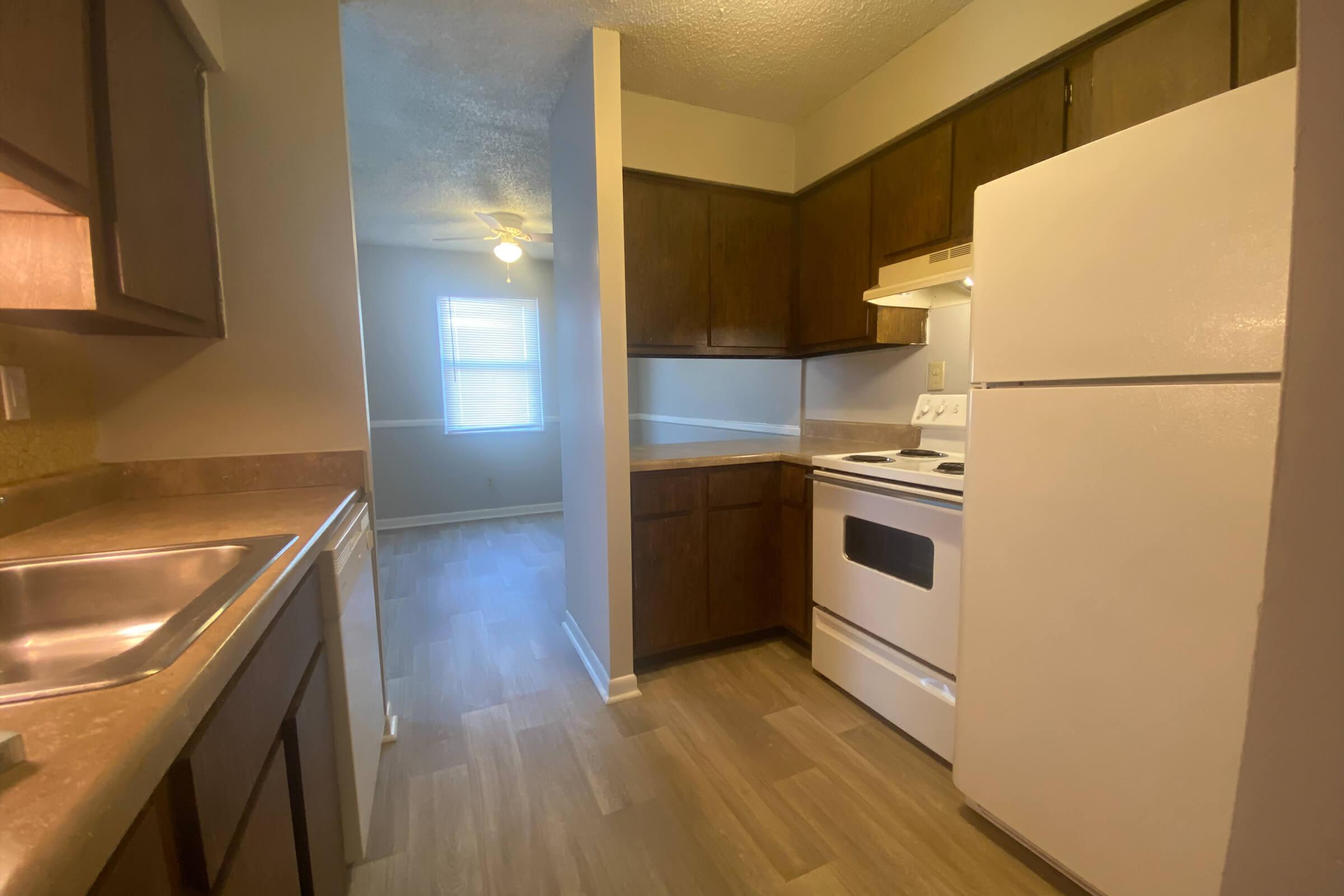 a kitchen with a stove and a refrigerator