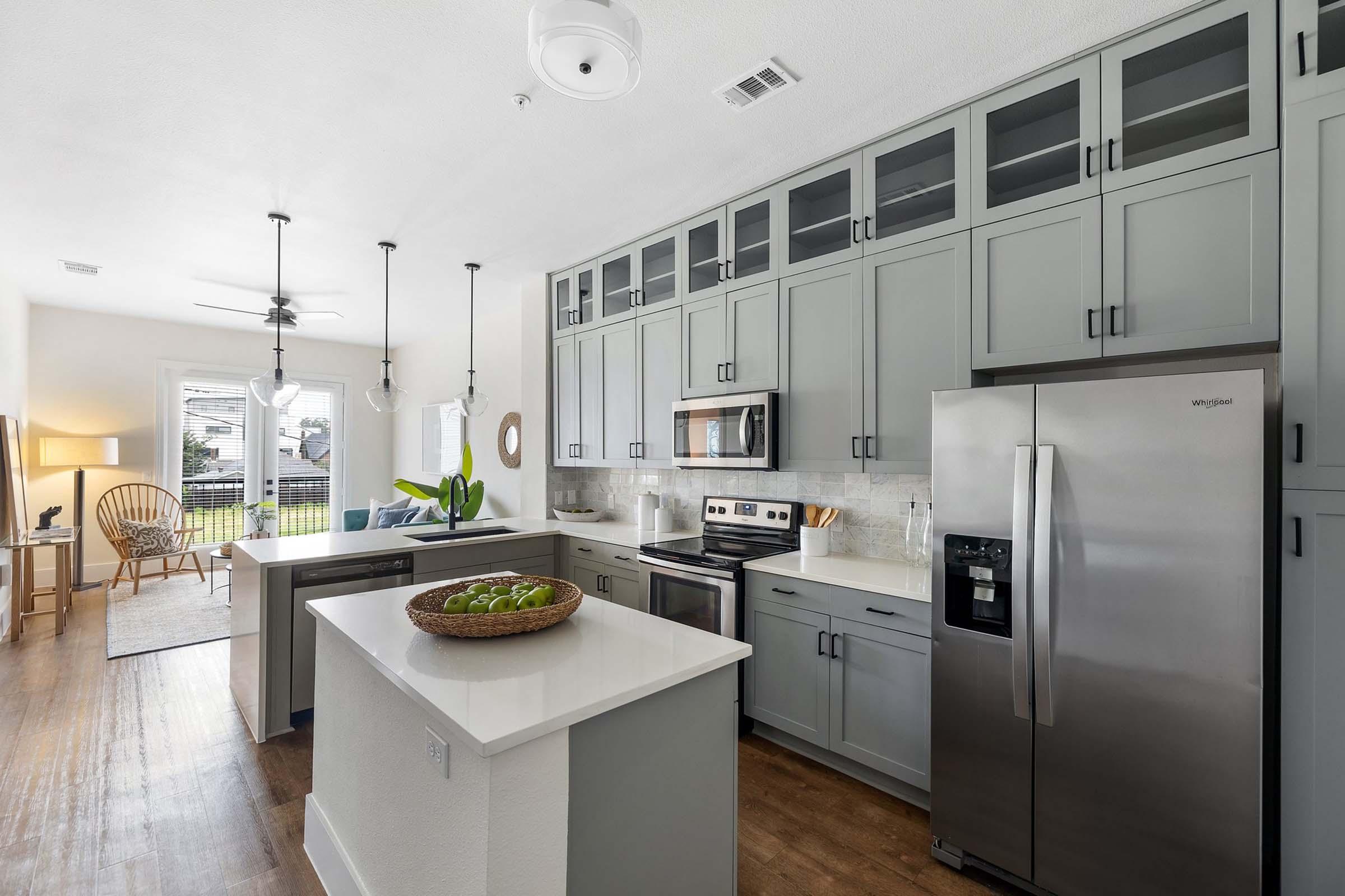 a kitchen with a sink and a refrigerator