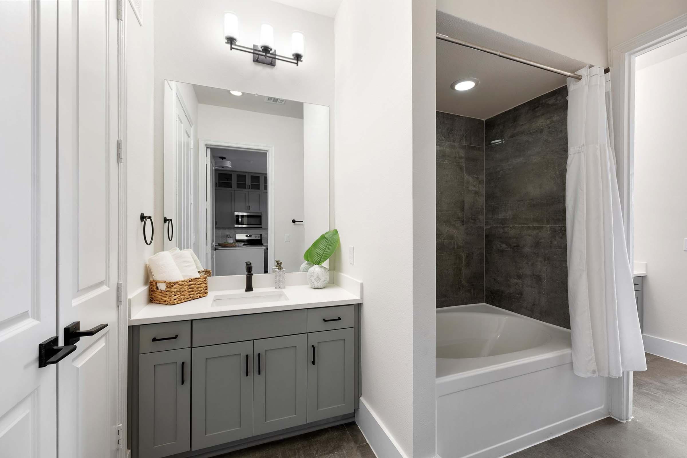 a kitchen with a sink and a mirror