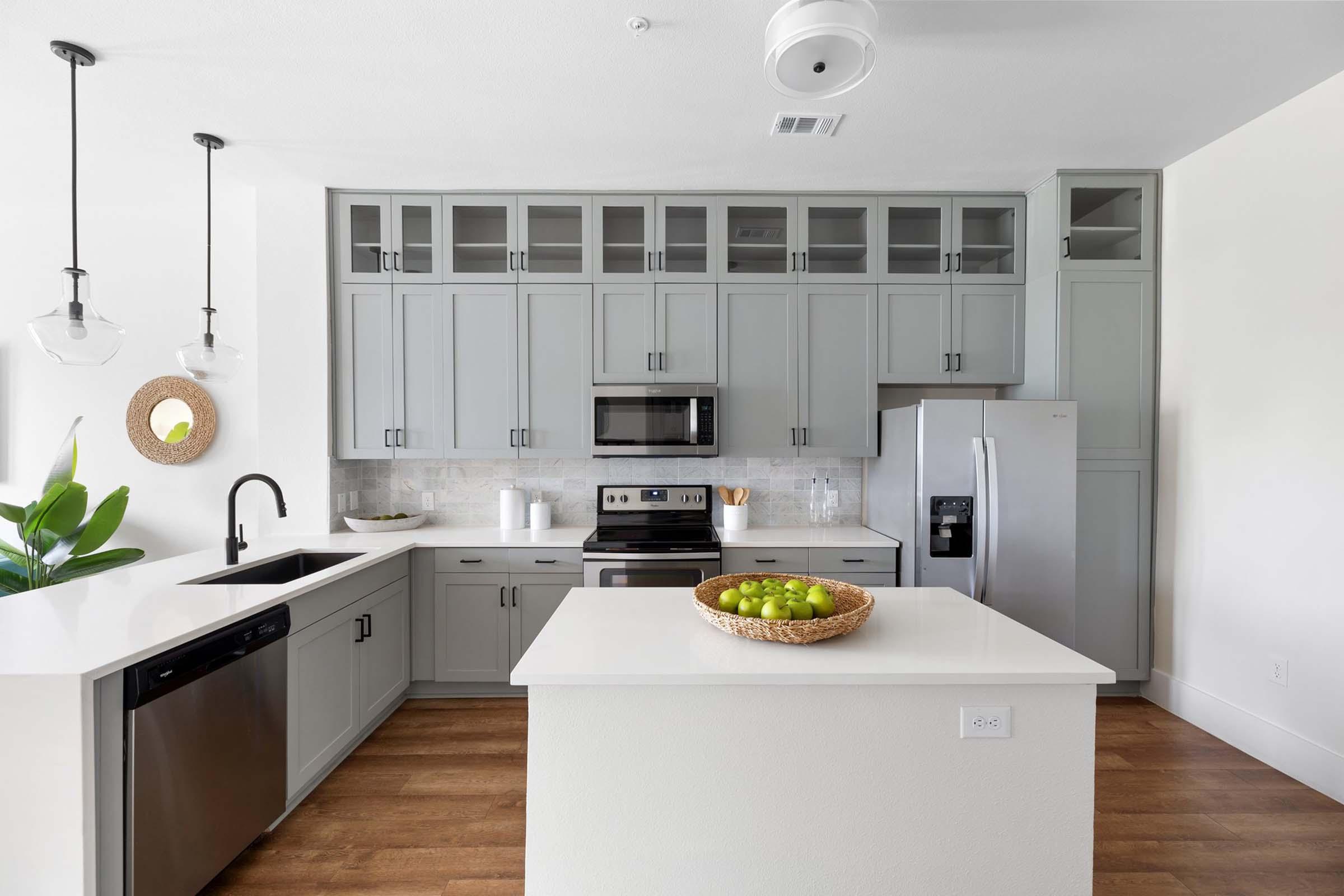 a kitchen with a sink and a microwave