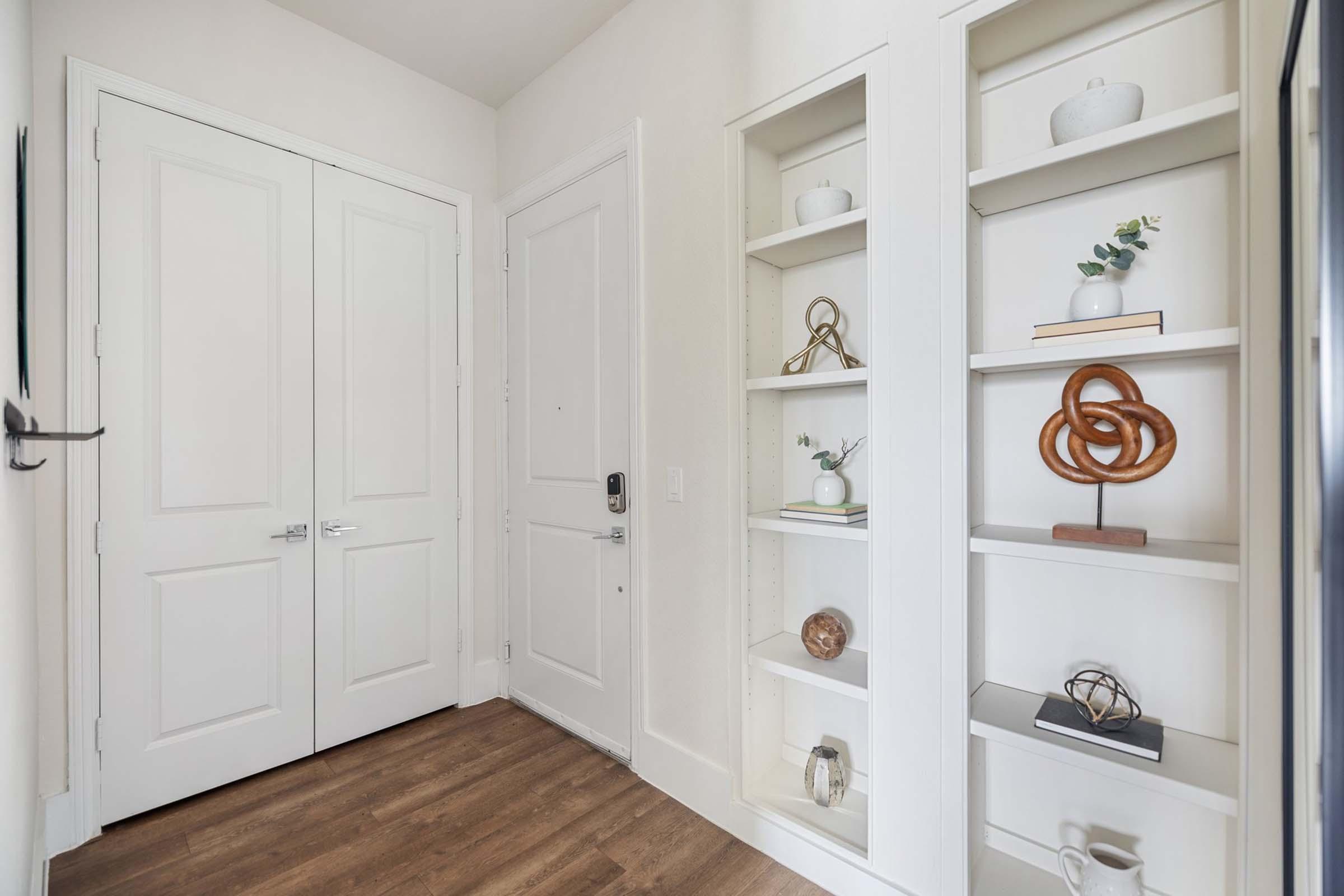 a kitchen with a sink and a mirror