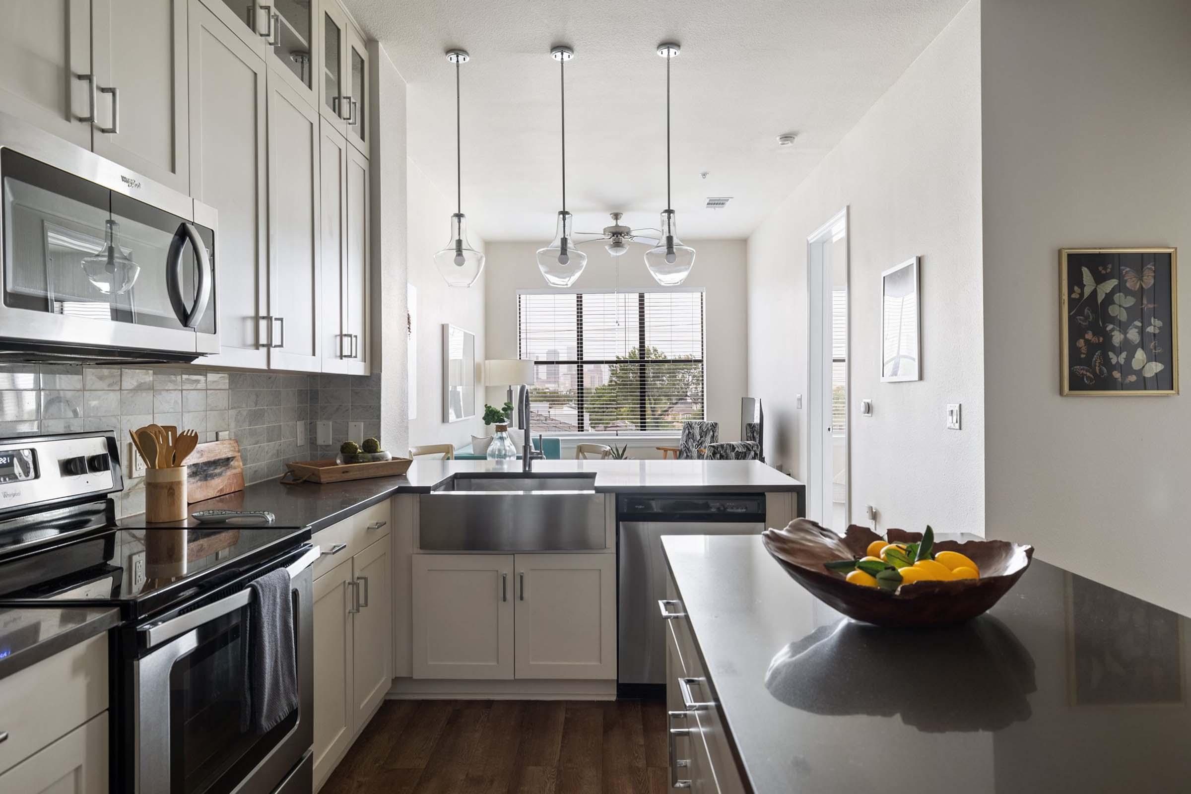 a large kitchen with stainless steel appliances