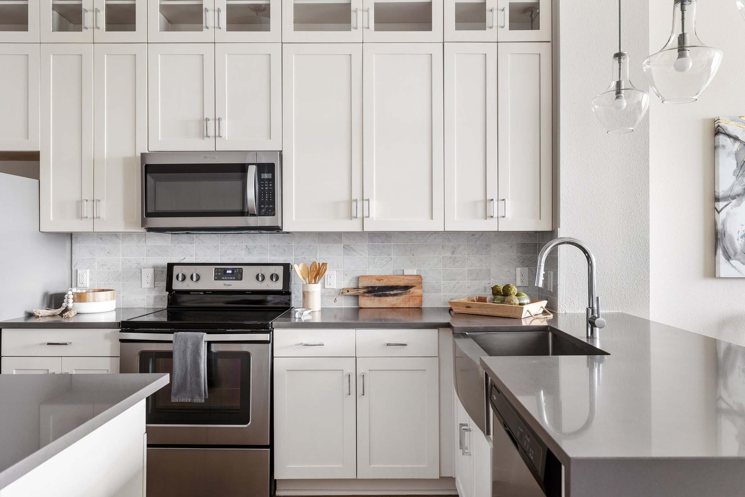 a kitchen with a sink and a window