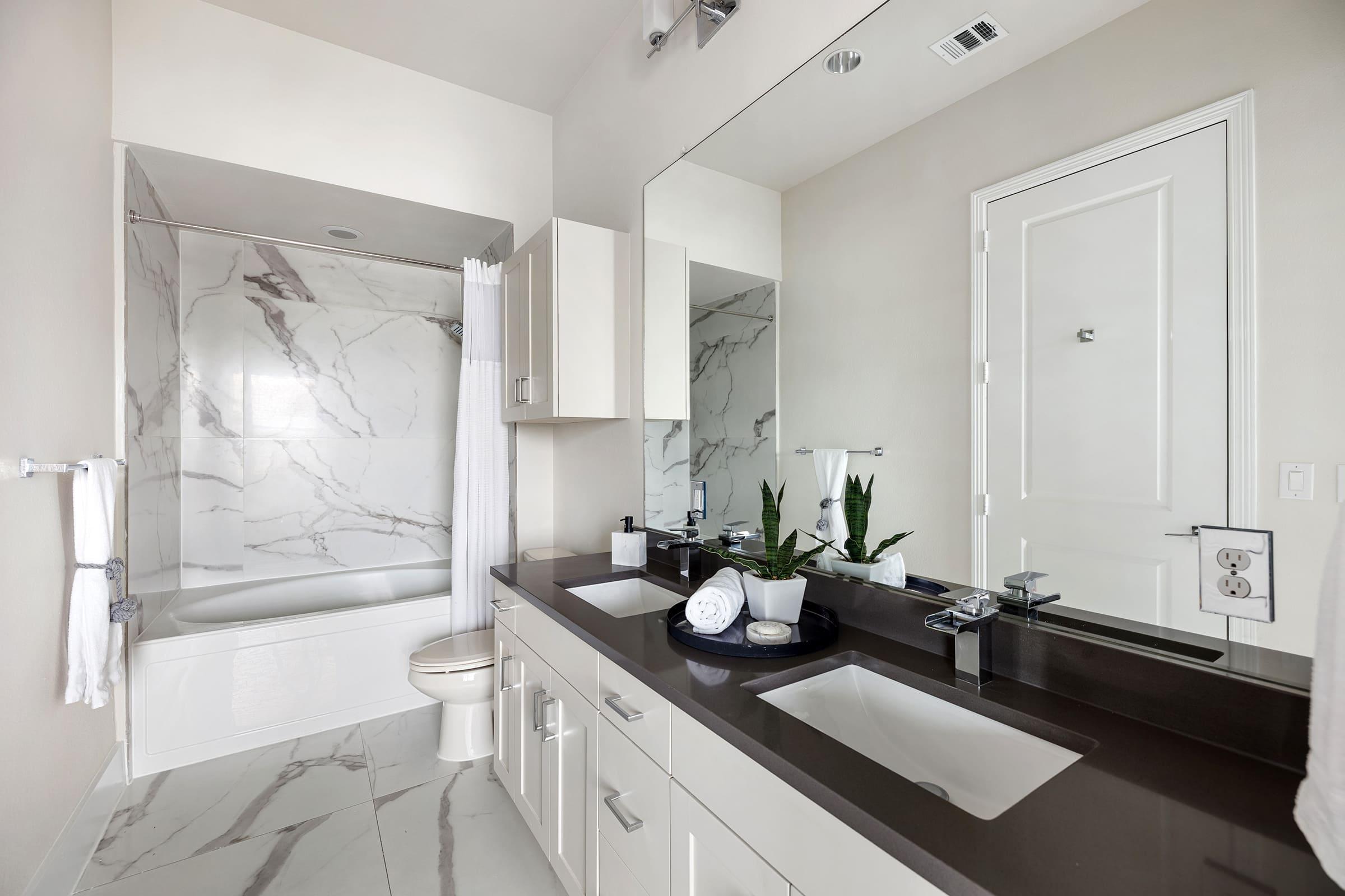 a kitchen with a sink and a mirror