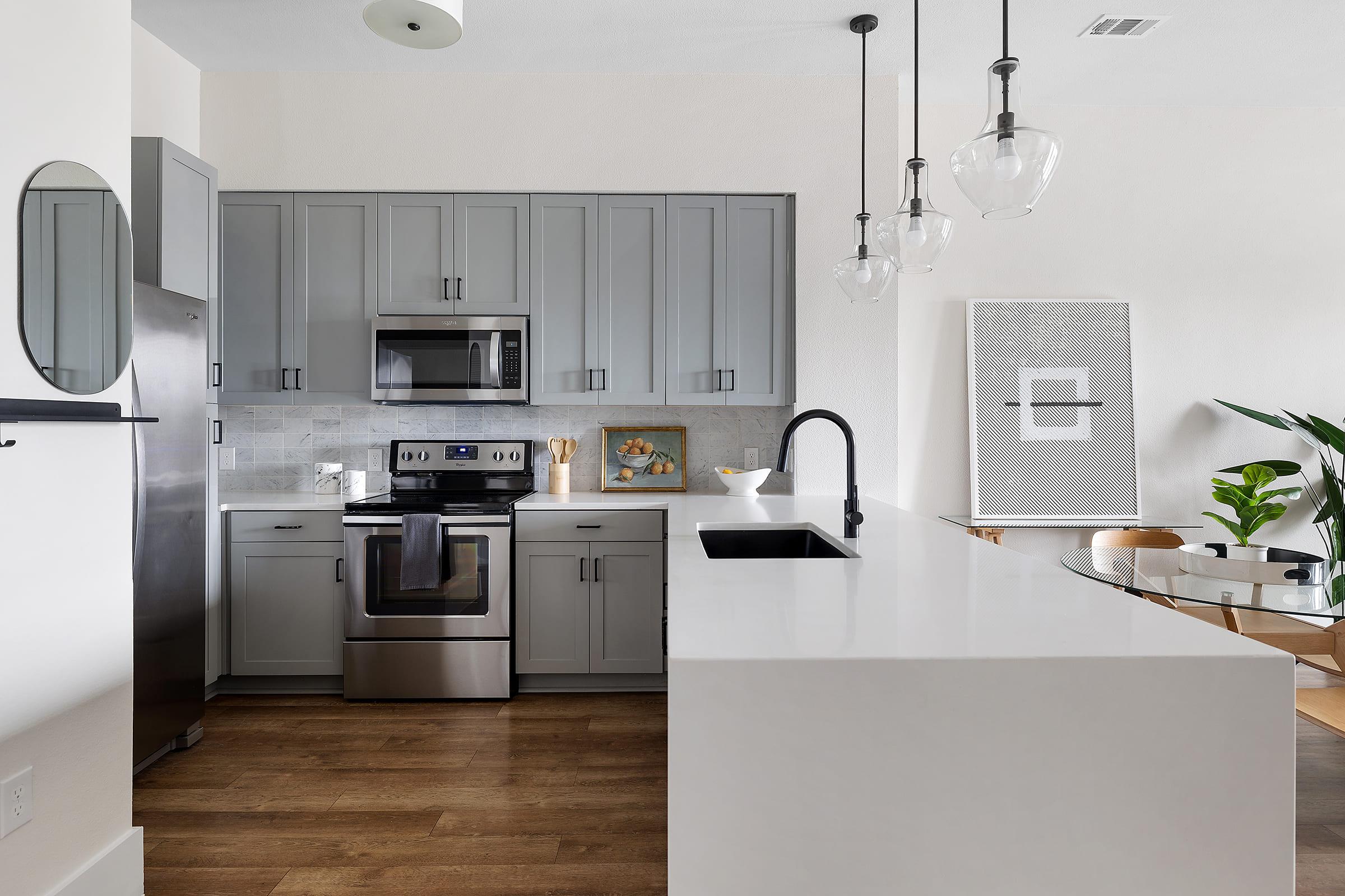 a kitchen with a sink and a refrigerator