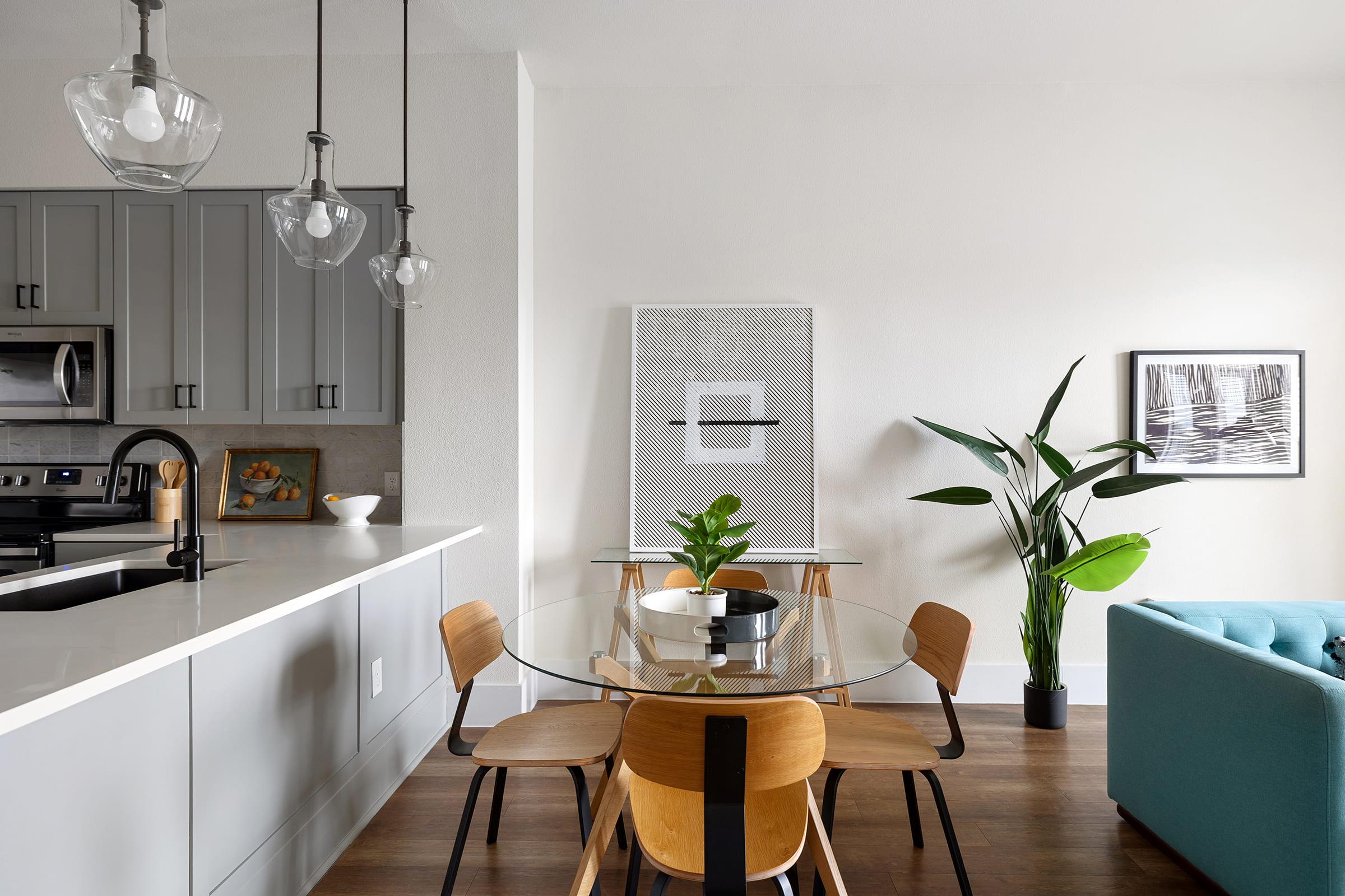 a living room filled with furniture and vase of flowers on a table