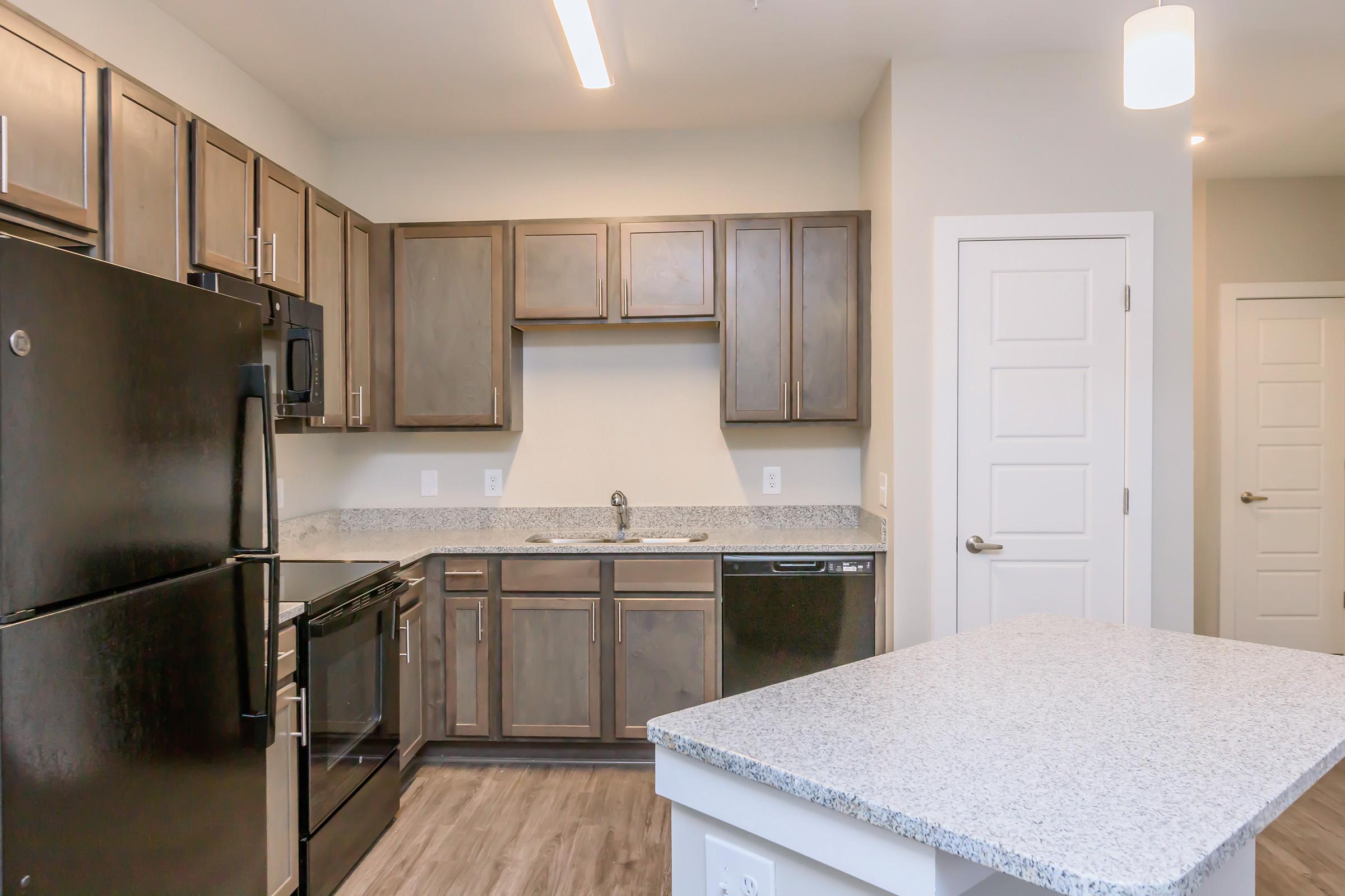 a large kitchen with stainless steel appliances