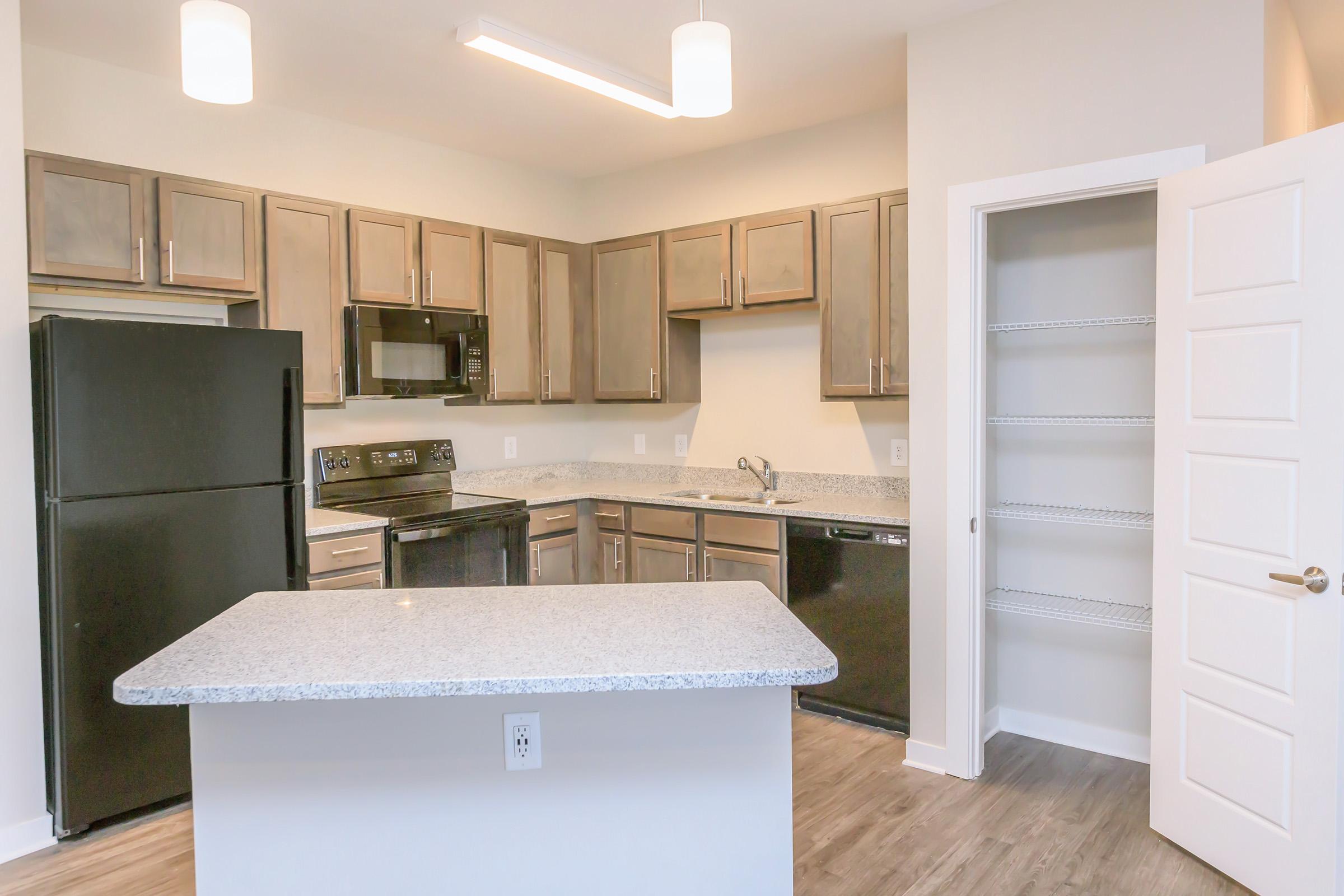 a kitchen with a sink and a refrigerator