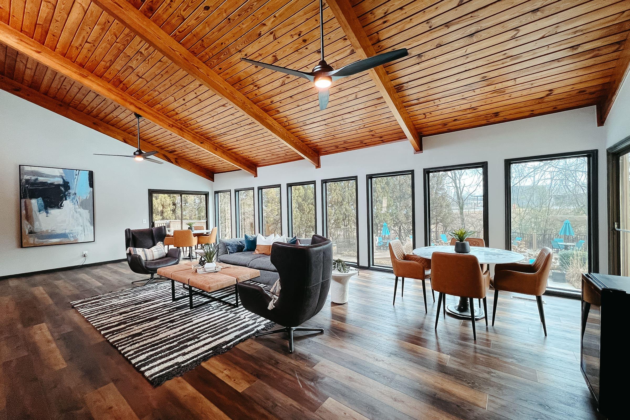 a room filled with furniture on top of a wooden table