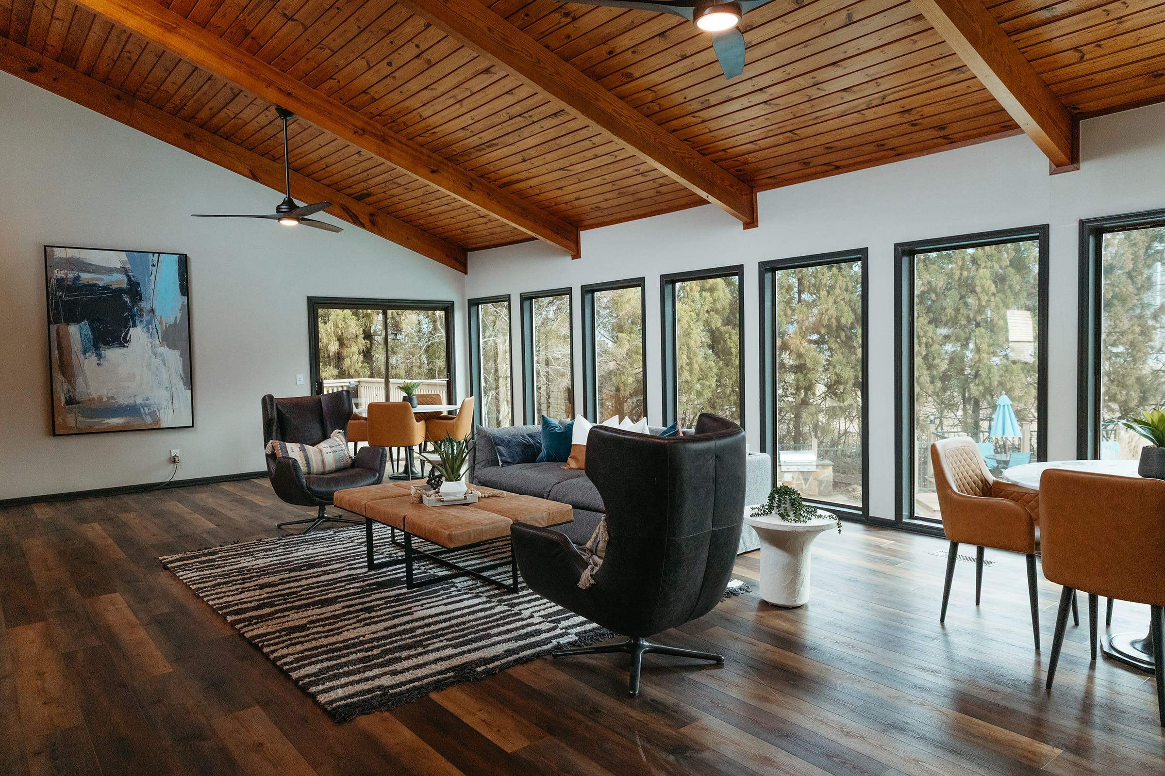 a living room filled with furniture and a large window