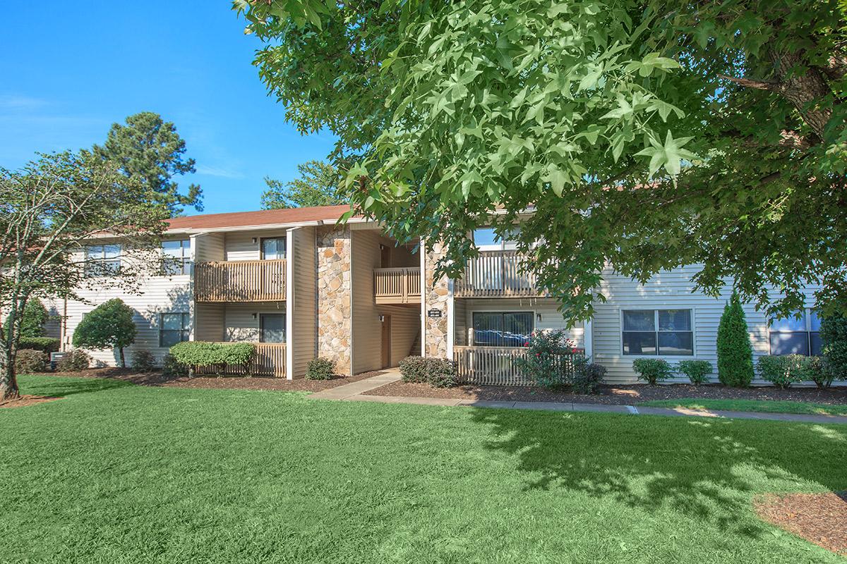 Lush grass landscaping and mature trees surrounds Laurel Ridge Apartments