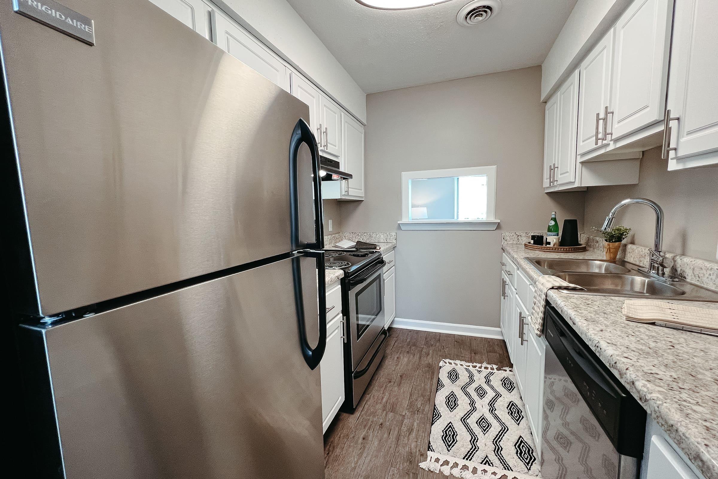 a stainless steel refrigerator in a kitchen