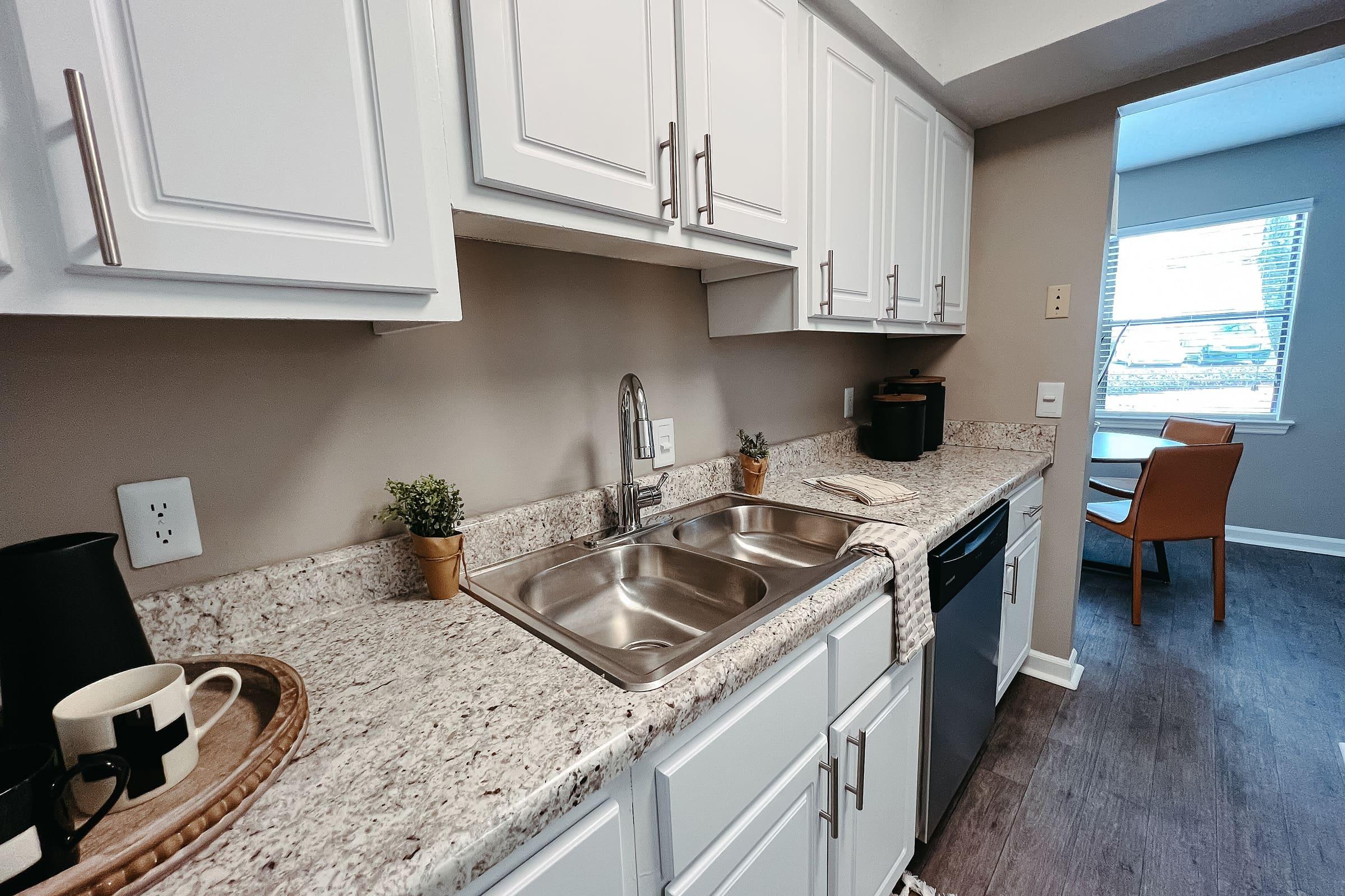 a kitchen with a sink and a window