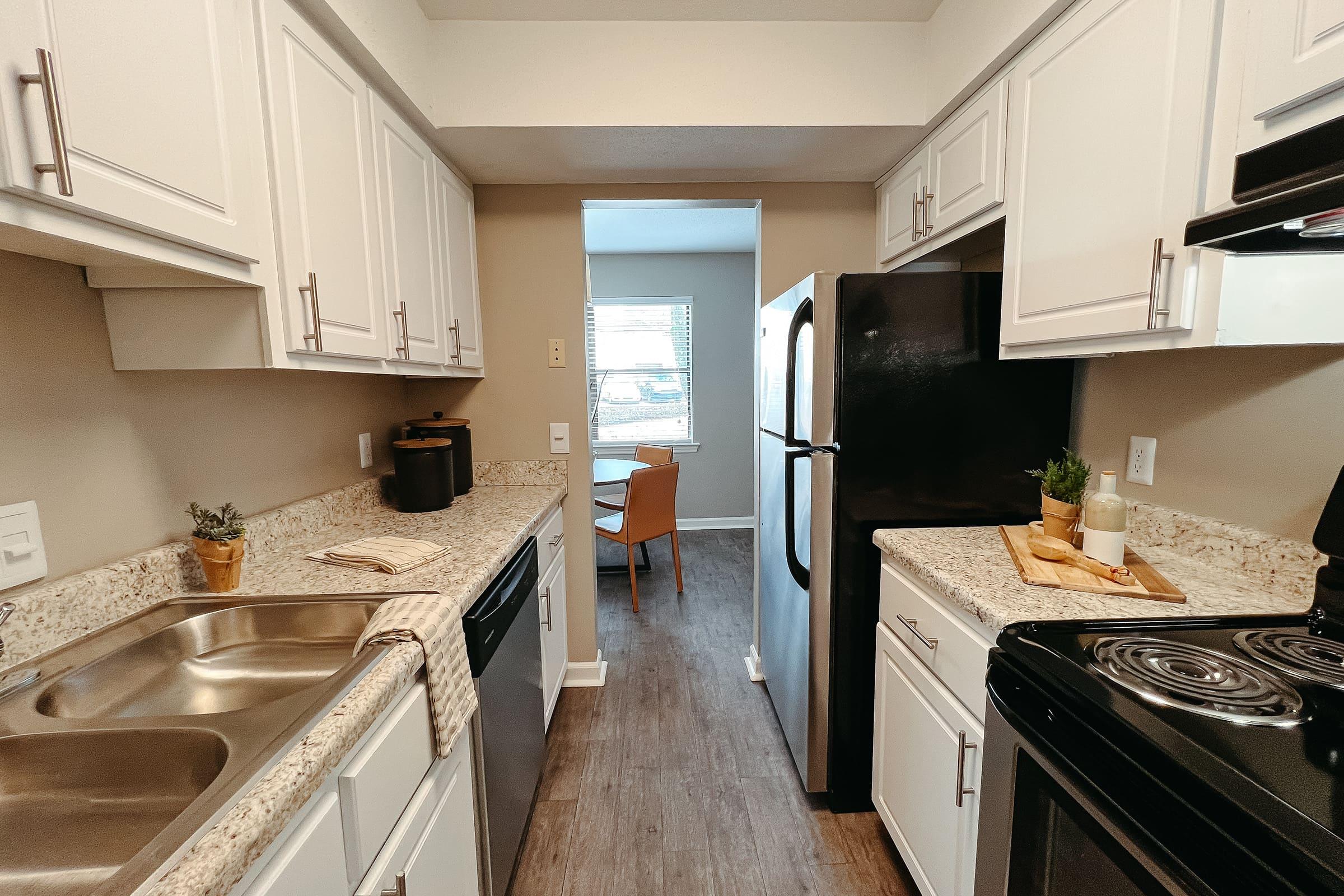 a kitchen with a stove and a sink